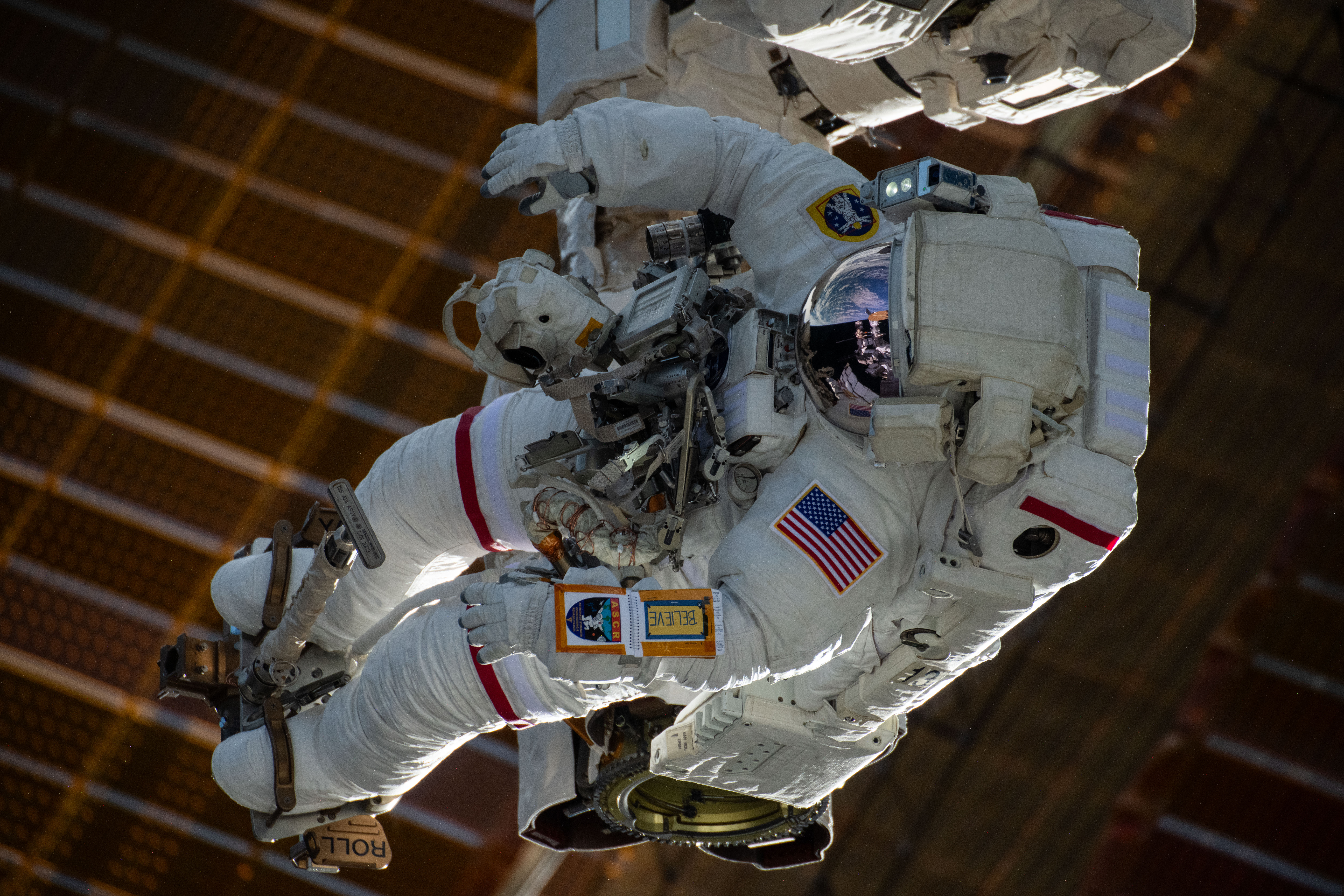Astronaut is attached to the Canadarm2 robotic arm's latching end effector