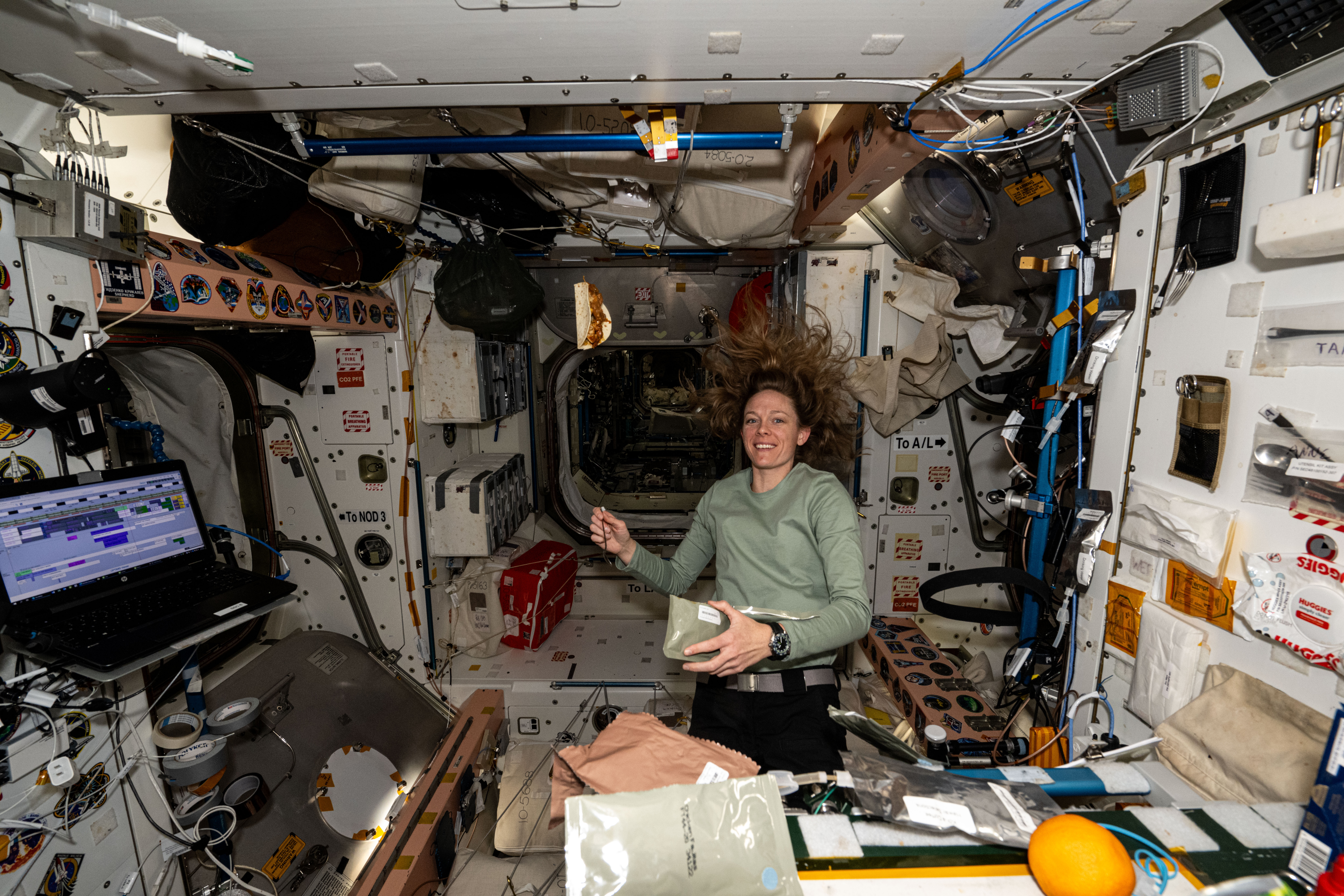 Astronaut prepares for a midday meal aboard the Unity module