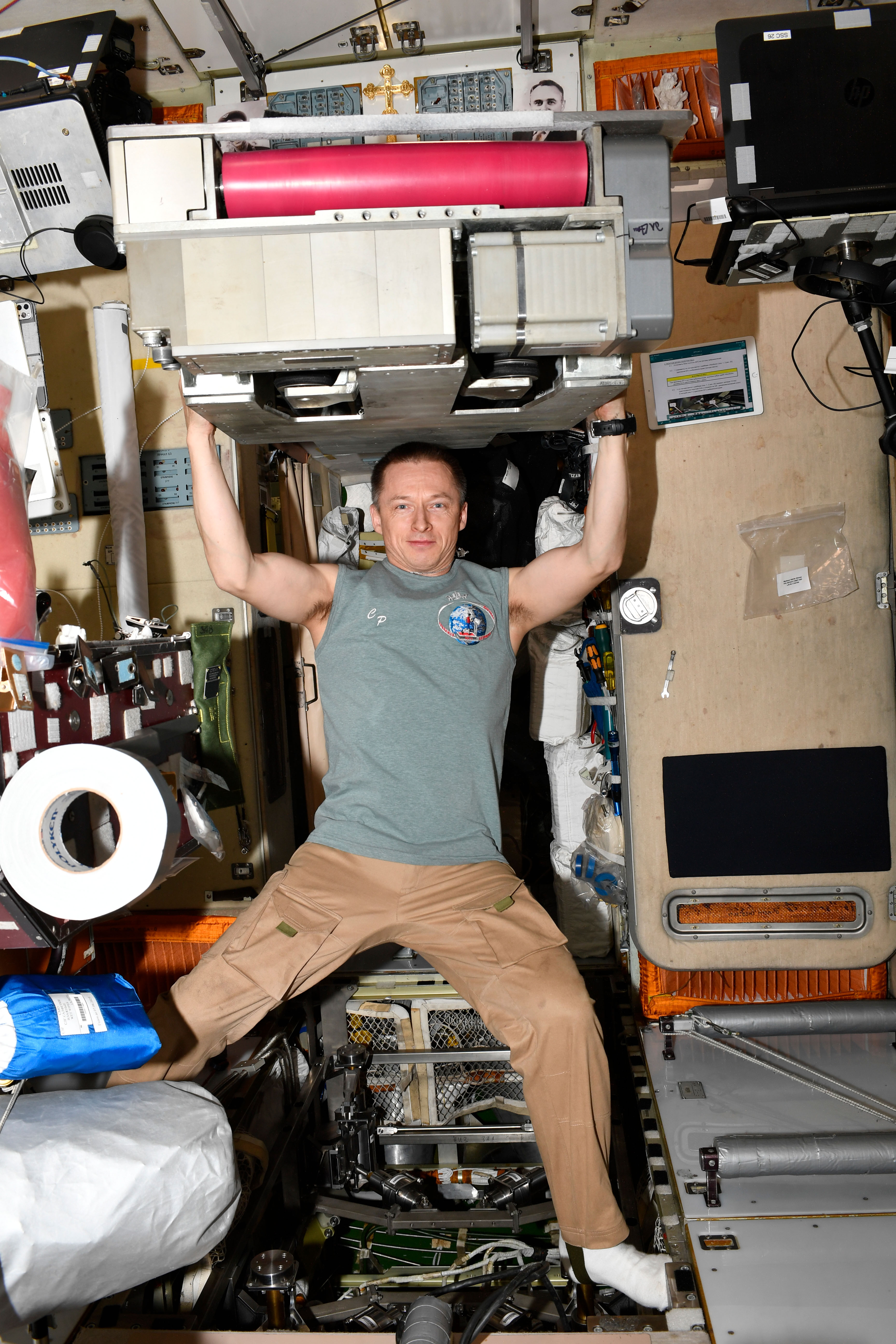 Roscosmos cosmonaut Sergey Ryzhikov poses for a playful portrait in Zvezda service module