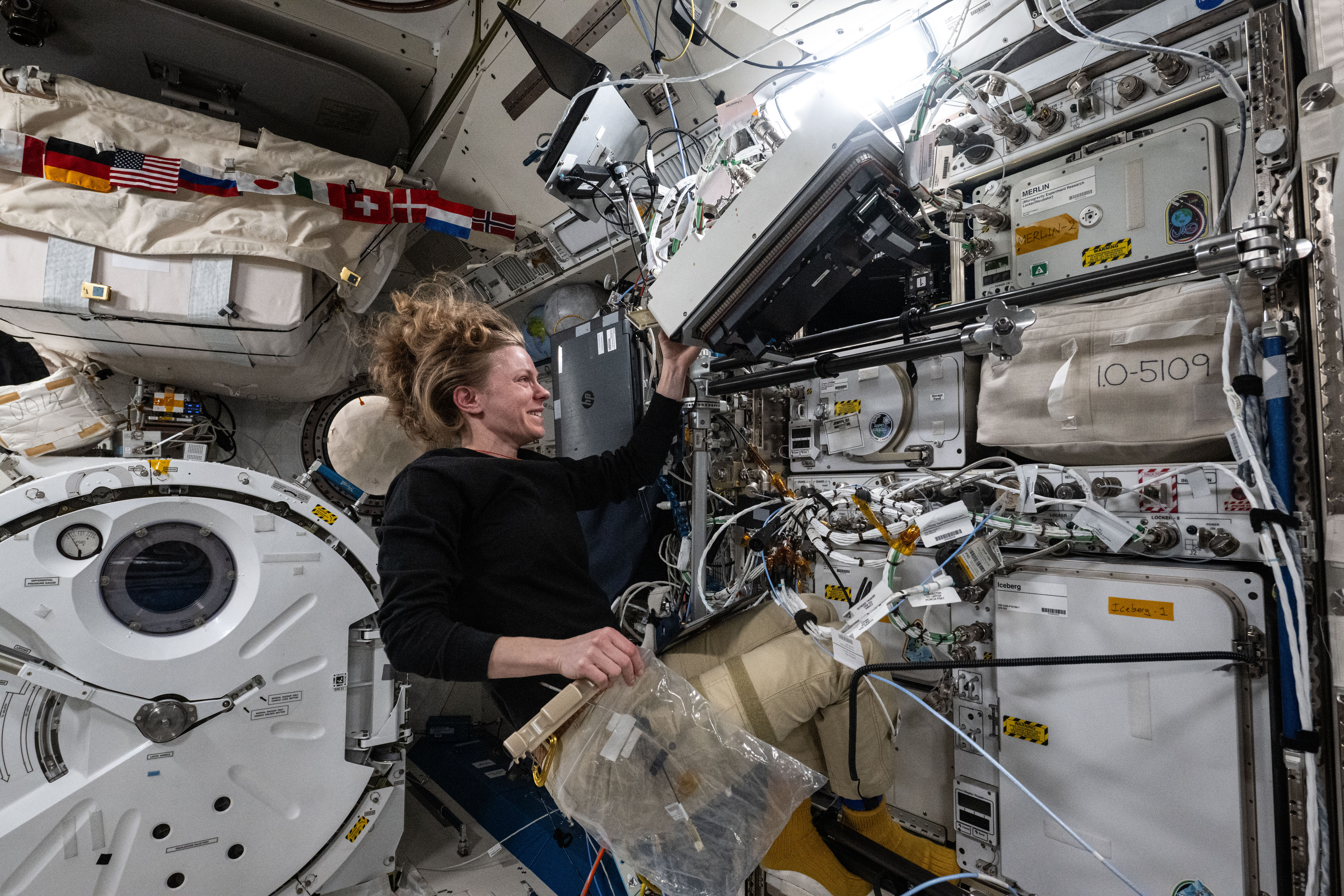 NASA astronaut Zena Cardman works inside the Kibo laboratory module