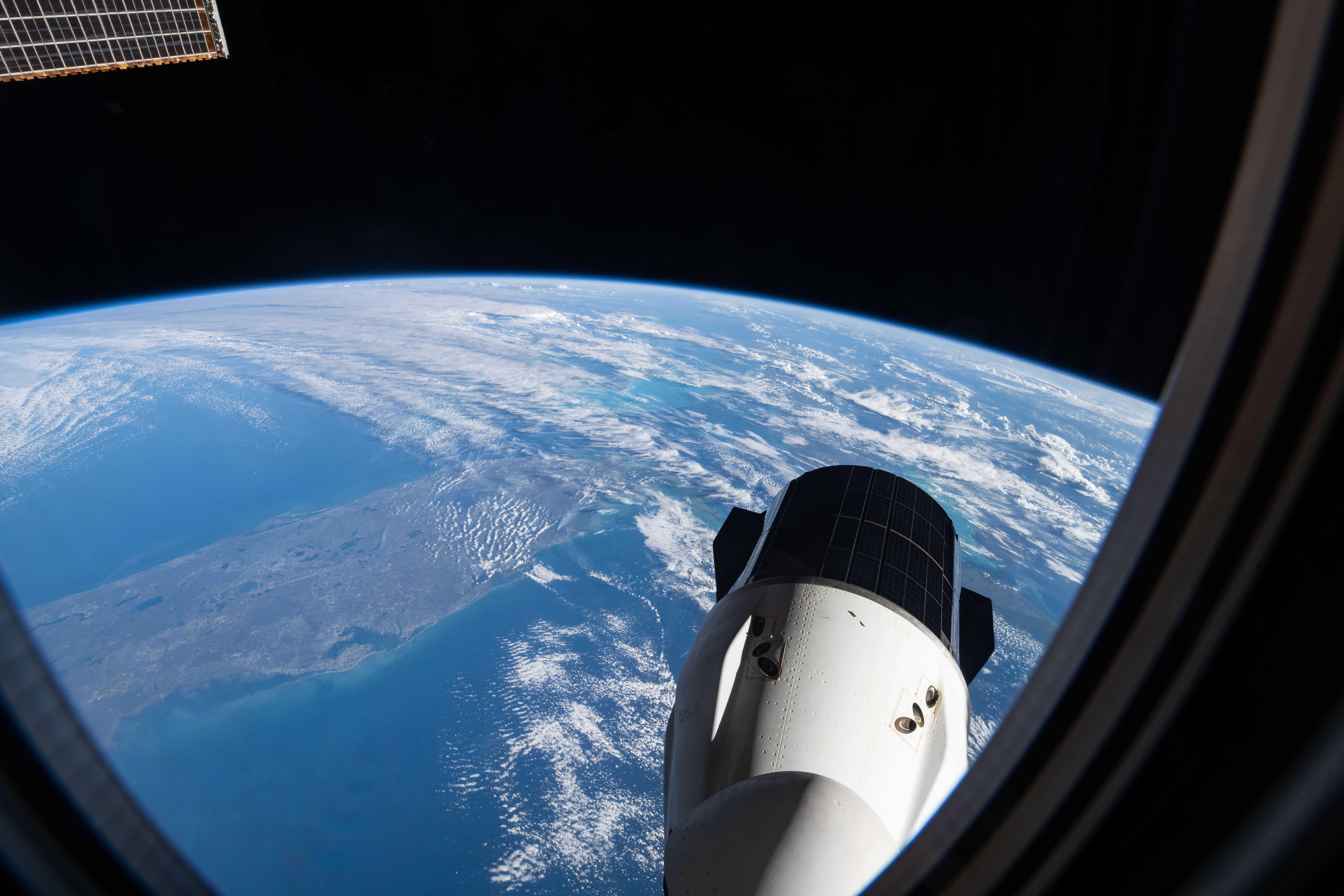 The SpaceX Dragon cargo spacecraft with southern Florida visible below