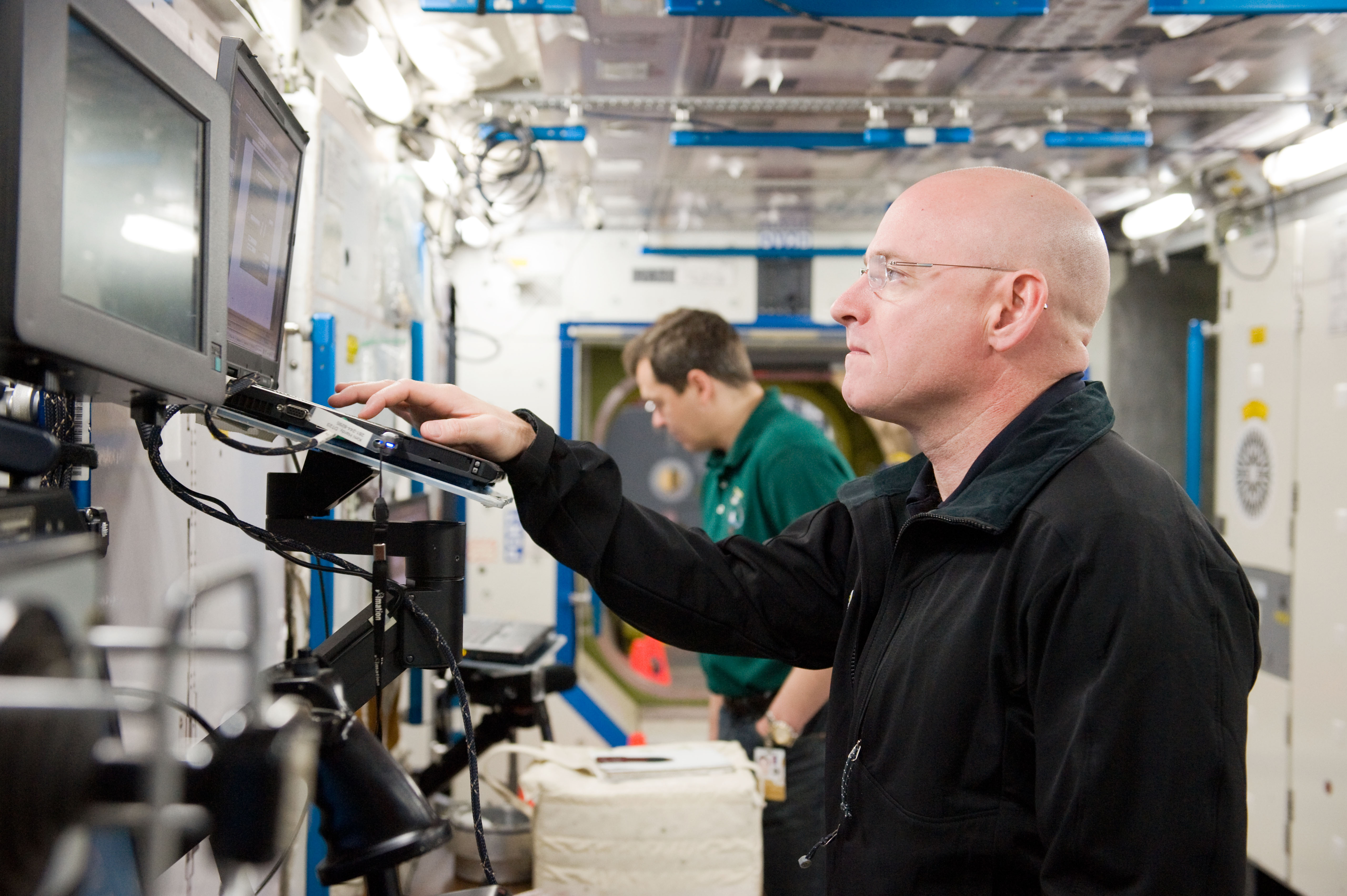 Expedition 25 crew members, Kaleri, Skripochka and S. Kelly during routine ops training.