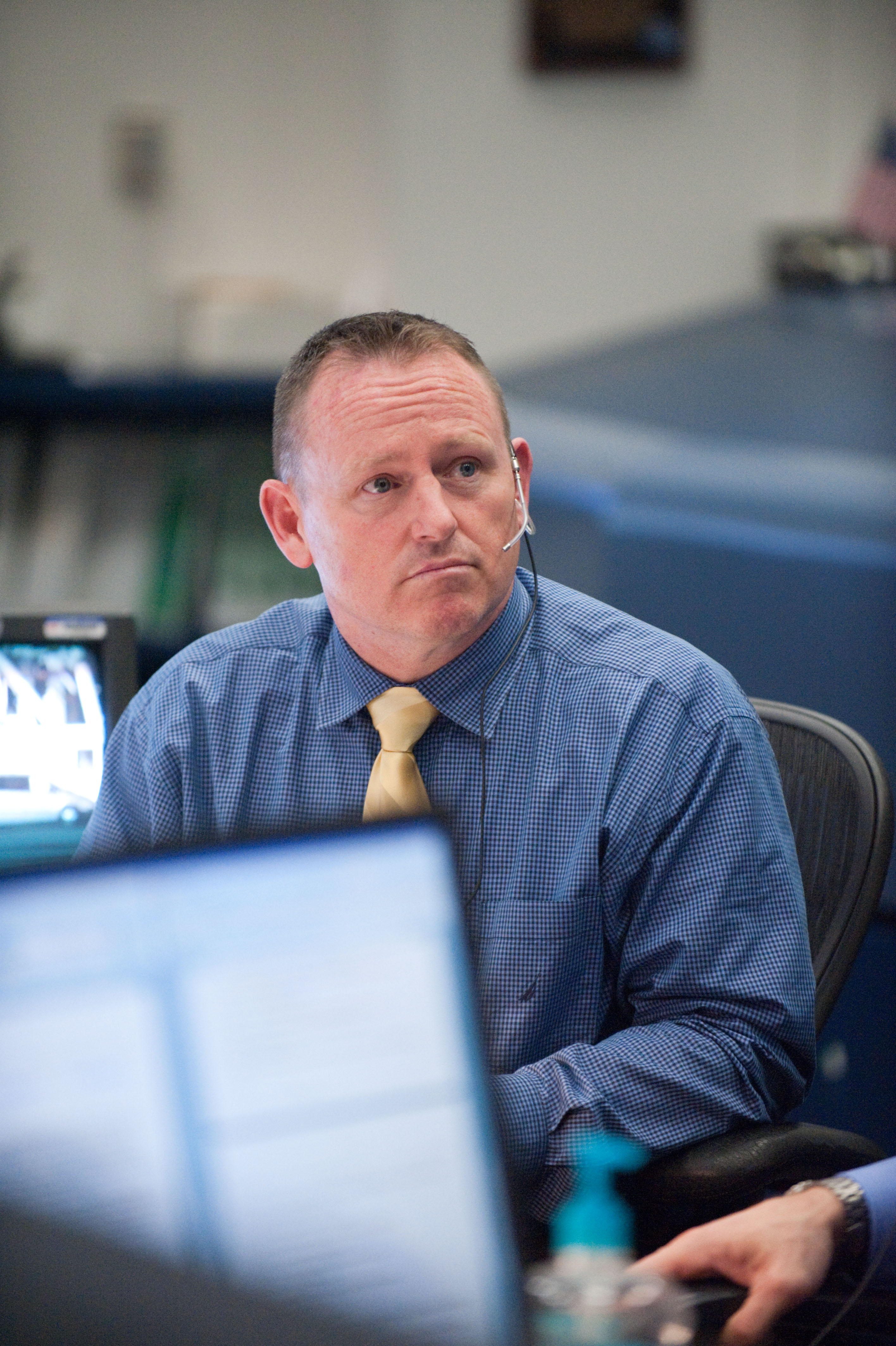 STS-133 flight controllers on console during the launch of Discovery