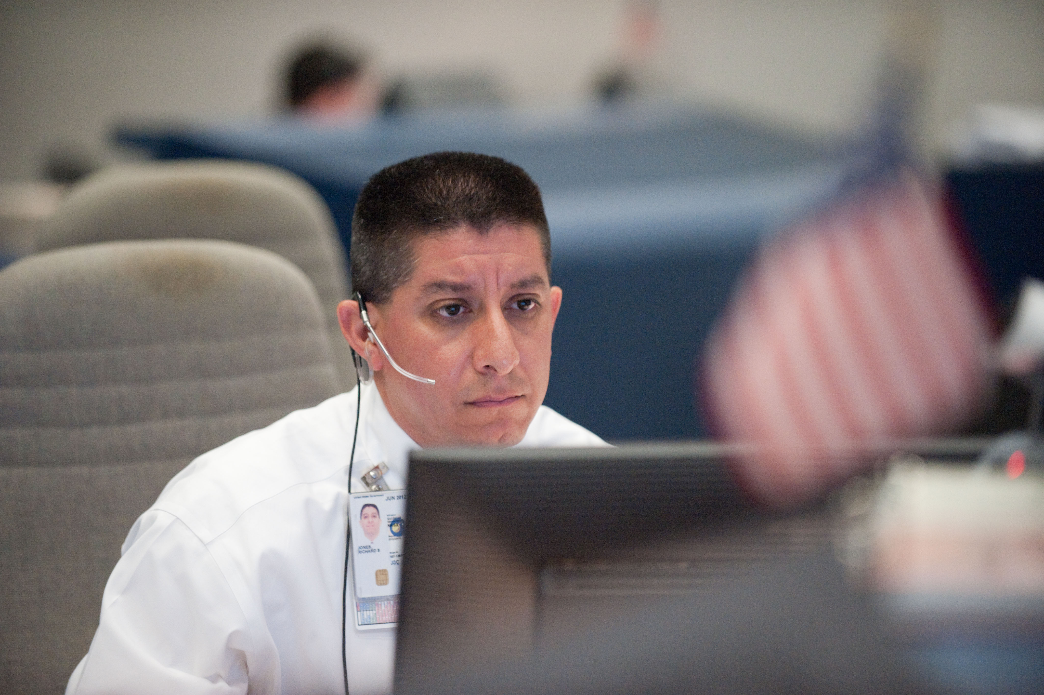 STS-133 flight controllers on console during the launch of Discovery