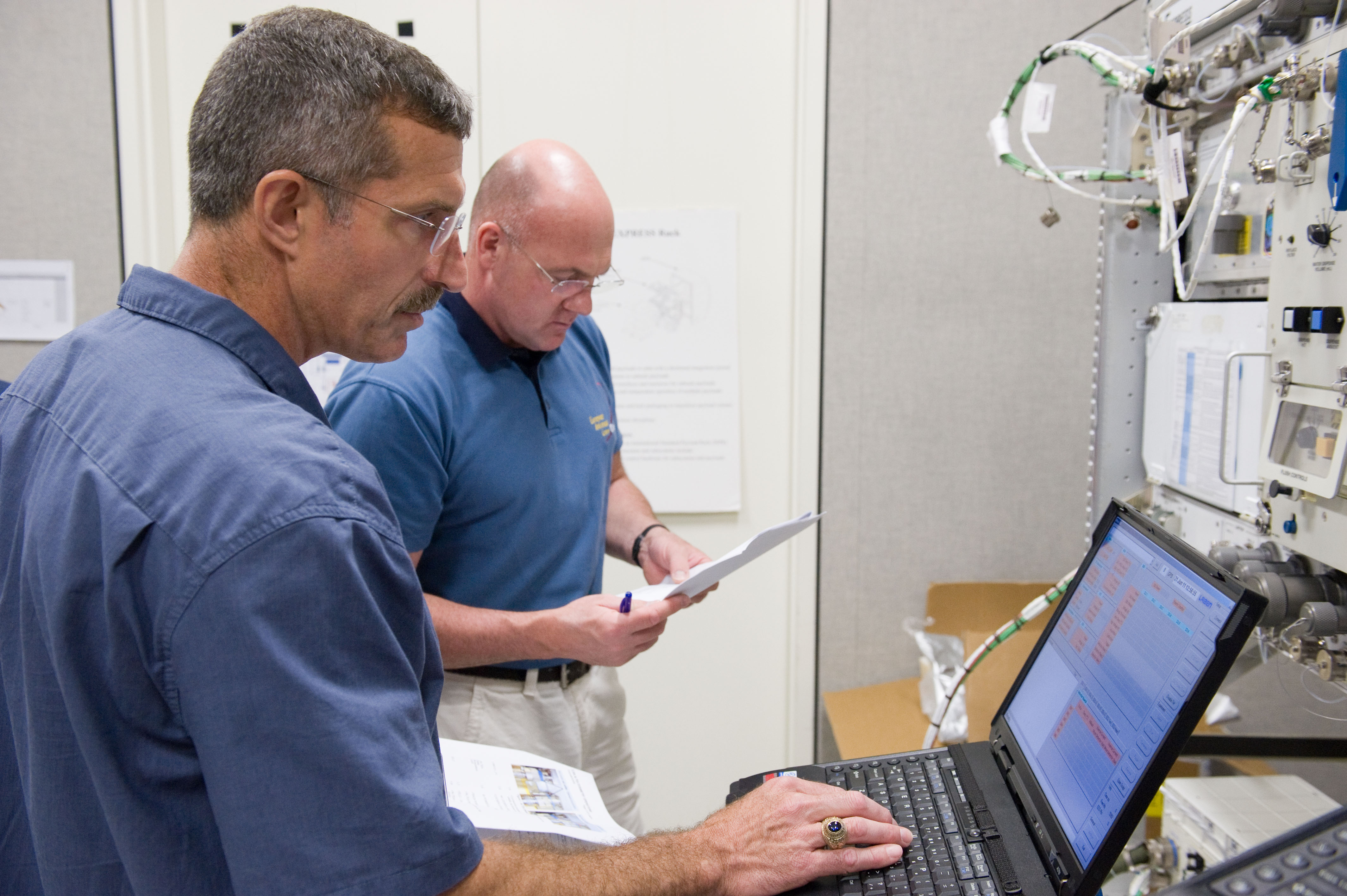 Expedition 29 crew members Dan Burbank and Andre Kuipers working with ALTEA Dosi training.
