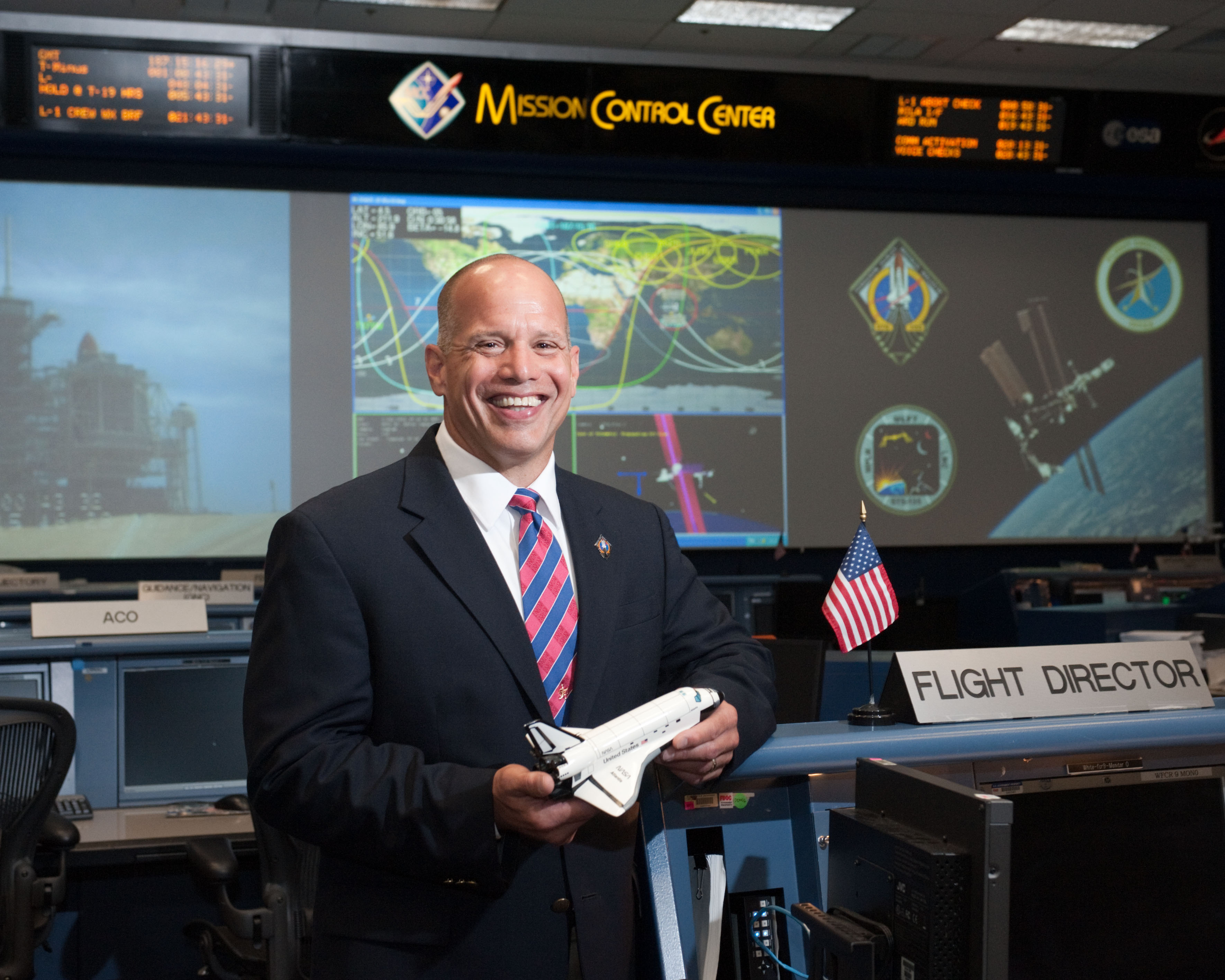STS-135 Flight Controllers on Console