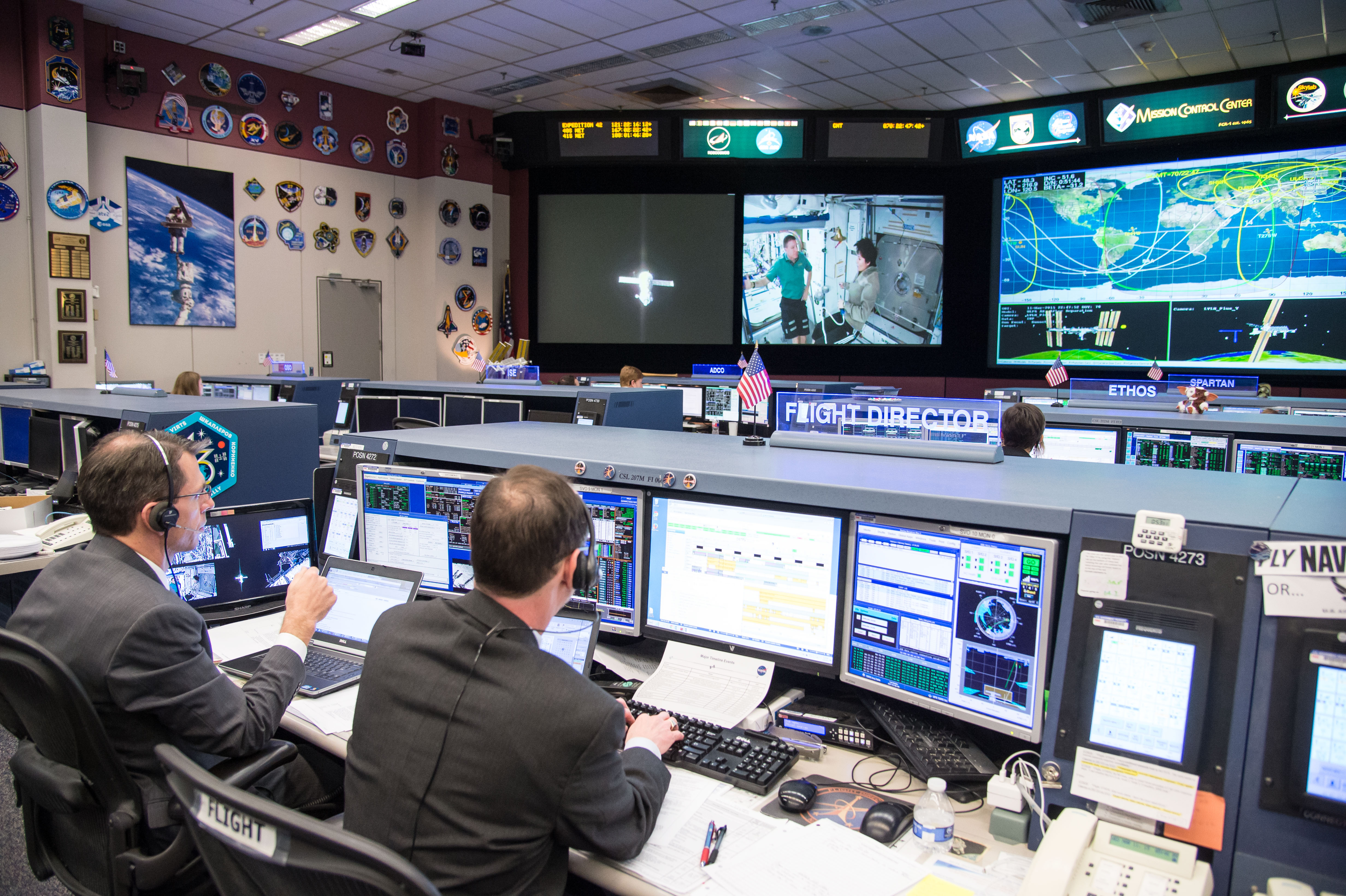 Date: 03-11-15.Location: Bldg 30, FCR-1.Subject: Expedition 42 flight controllers on console in FCR-1 during the undocking of Expedition 42 crew (Samokutyaev, Wilmore, Serova) on the Soyuz TMA-14M spacecraft from the Poisk module on ISS.Photographer: James Blair