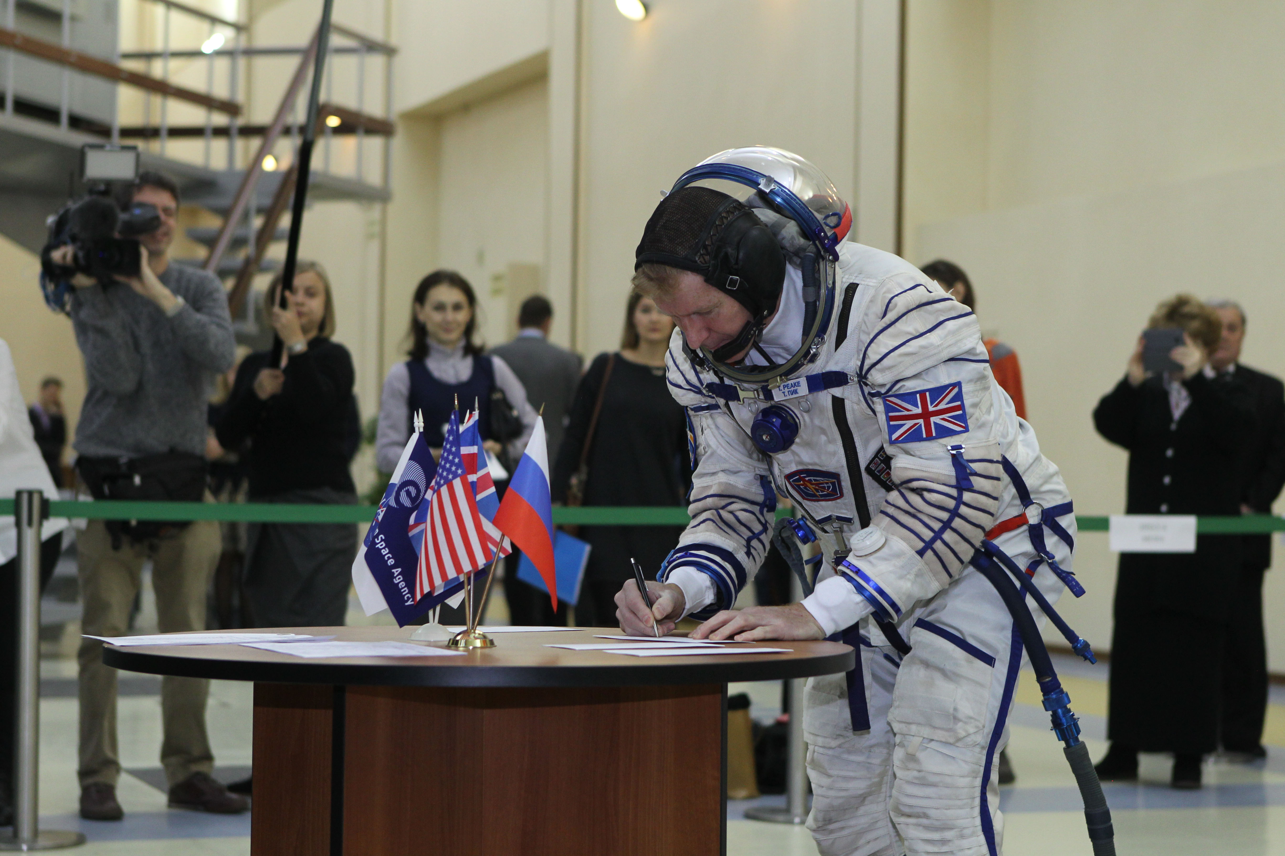 At the Gagarin Cosmonaut Training Center in Star City, Russia, Expedition 46-47 crewmember Tim Peake of the European Space Agency signs in for his qualification exam Nov. 20. Along with Yuri Malenchenko of the Russian Federal Space Agency (Roscosmos) and Tim Kopra of NASA, Peake will launch Dec. 15 on the Soyuz TMA-19M spacecraft Dec. 15 from the Baikonur Cosmodrome in Kazakhstan for a six-month mission on the International Space Station..NASA/Seth Marcantel
