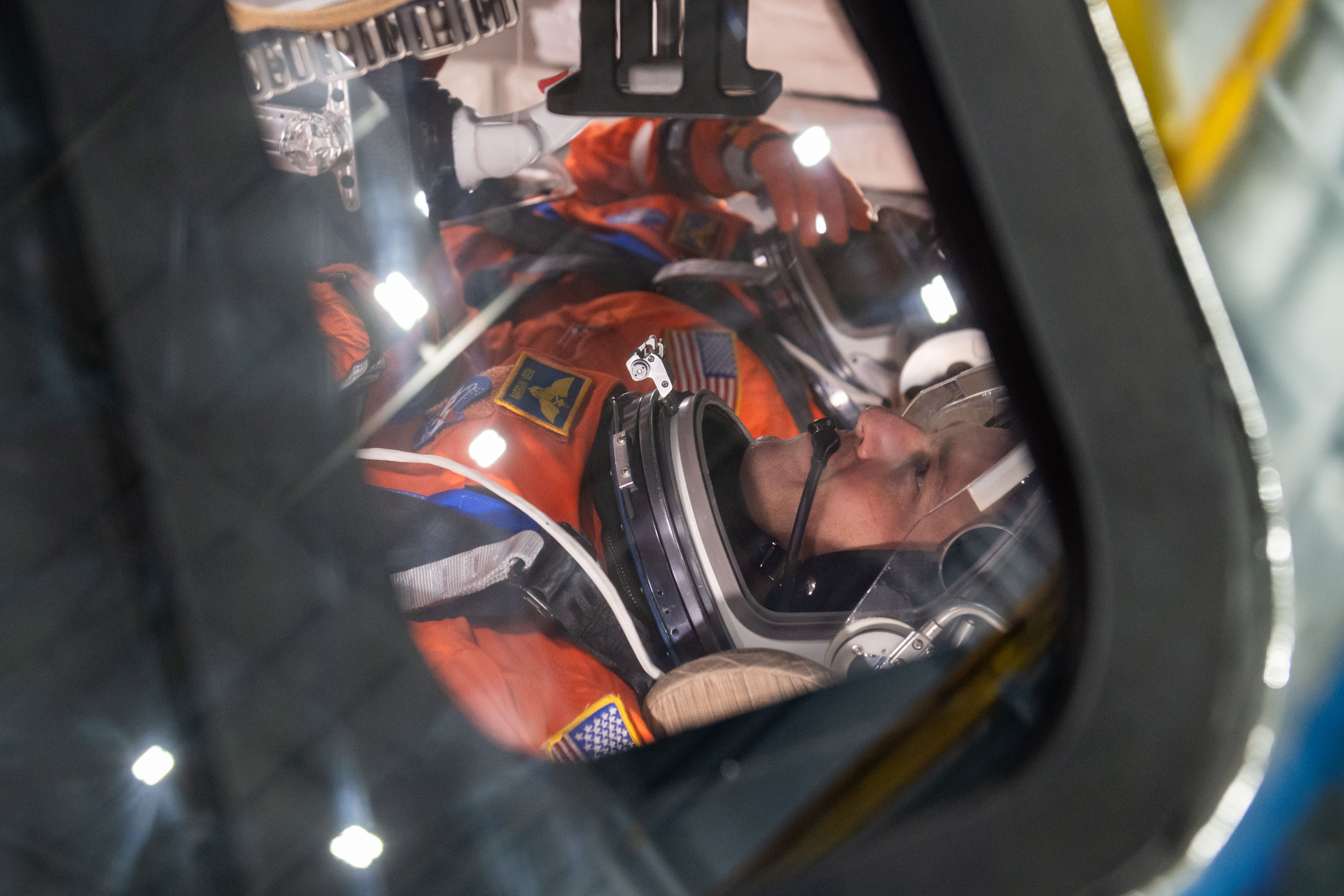 NASA astronaut and Artemis II commander Reid Wiseman inside of the Orion spacecraft mockup
