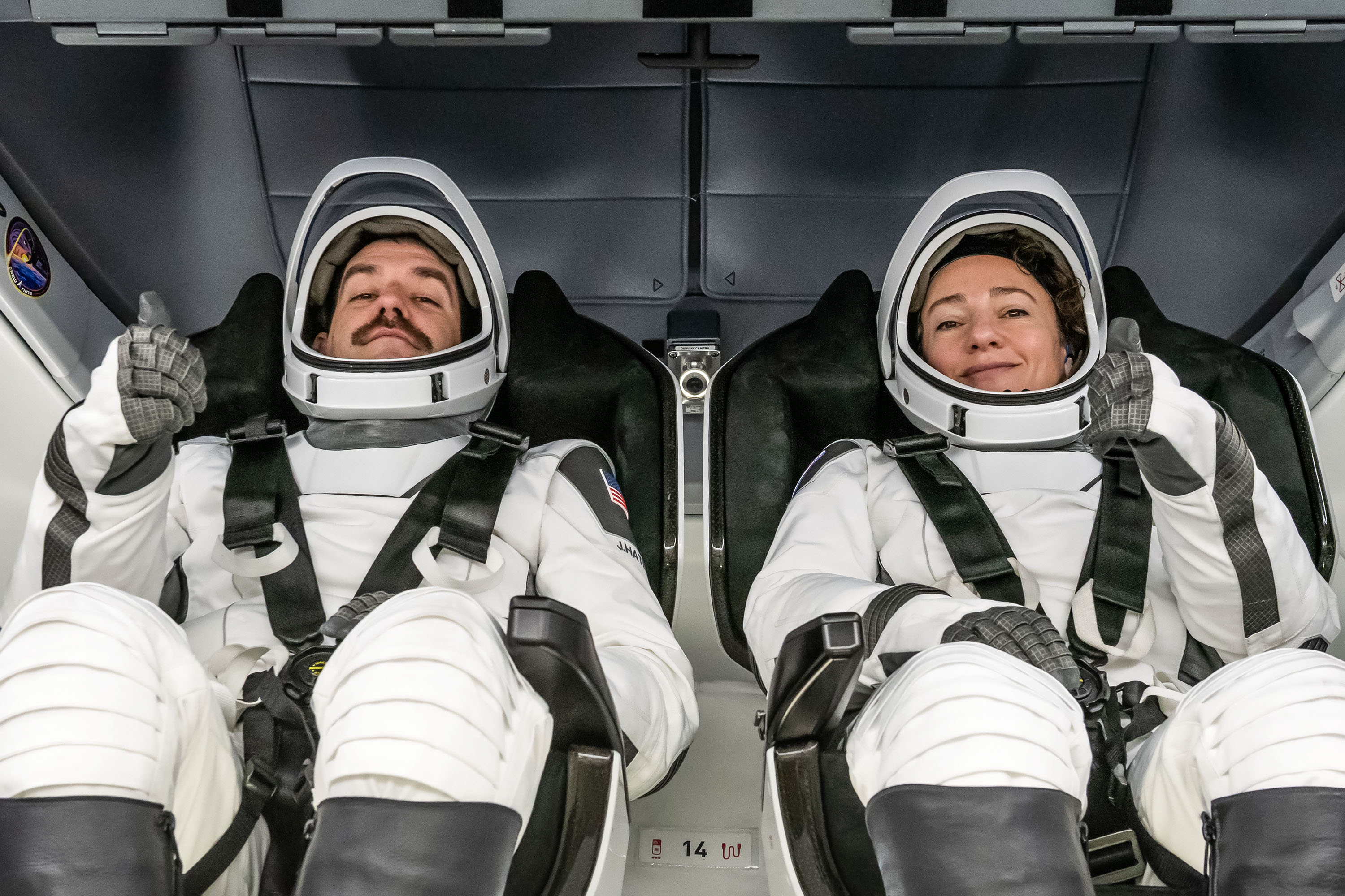 NASA astronauts Jack Hathaway and Jessica Meir are photographed inside the Dragon spacecraft