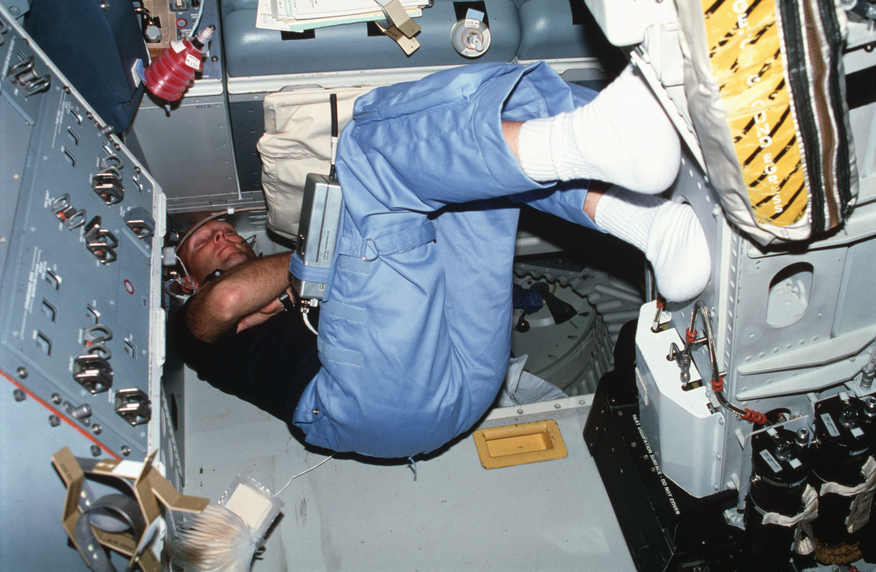 Pilot Fullerton sleeps on aft flight deck