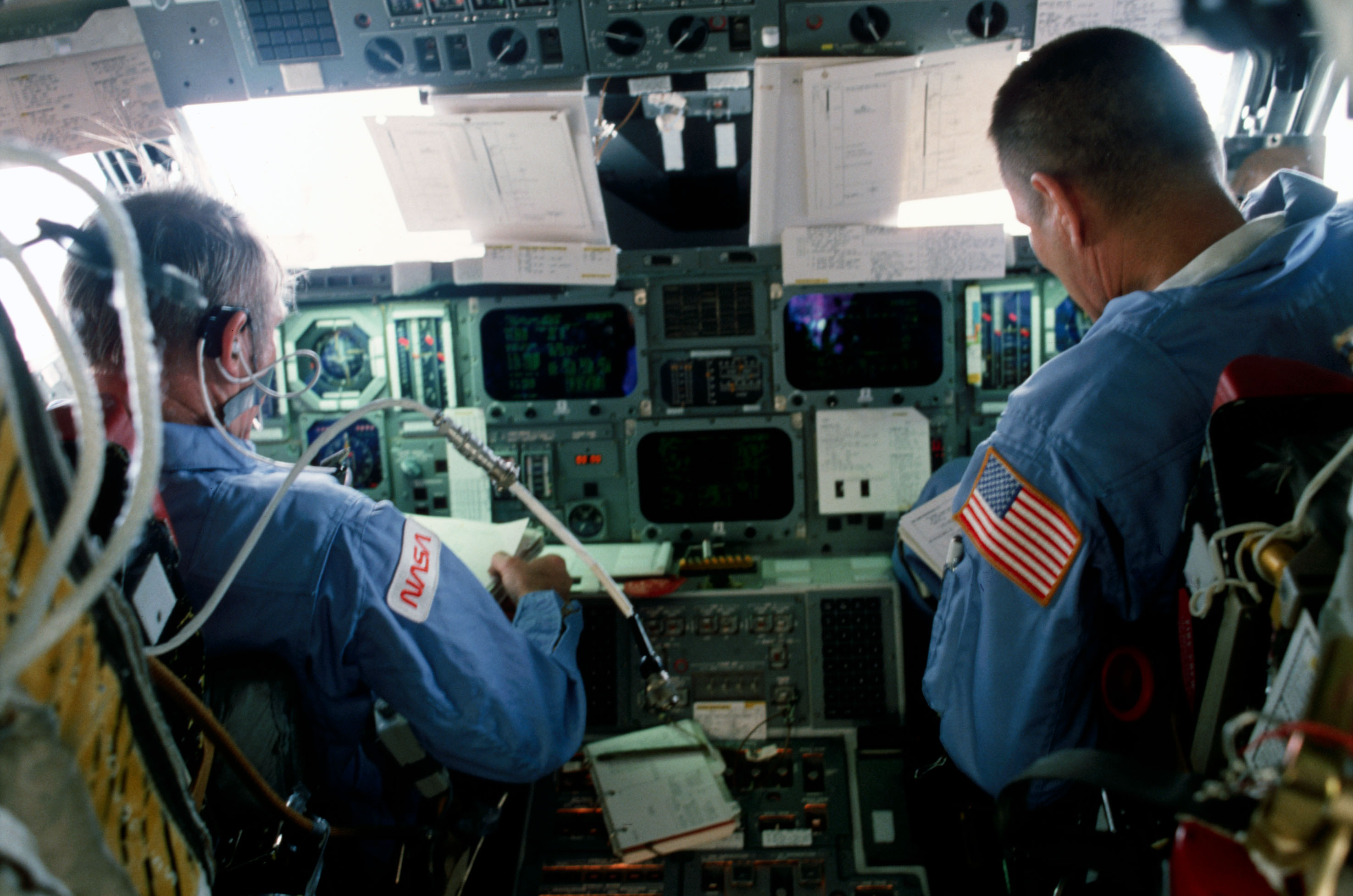 Commander Brand and Pilot Overmyer operate controls on forward flight deck
