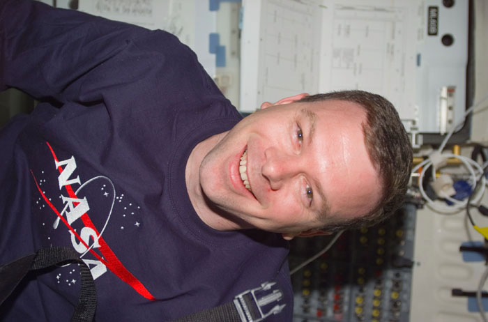 Kelly smiles for the camera in the middeck