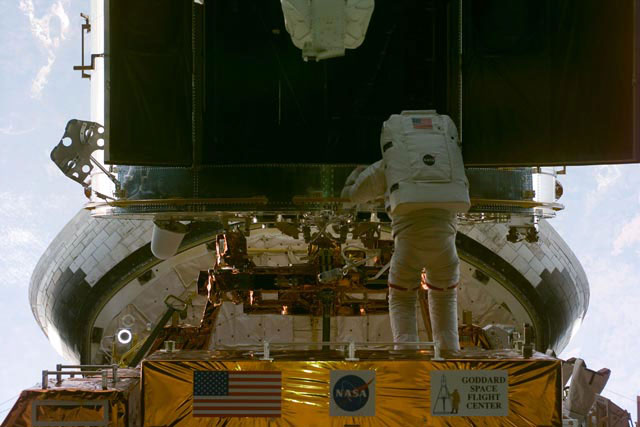 EVA-1 - Smith working on the HST
