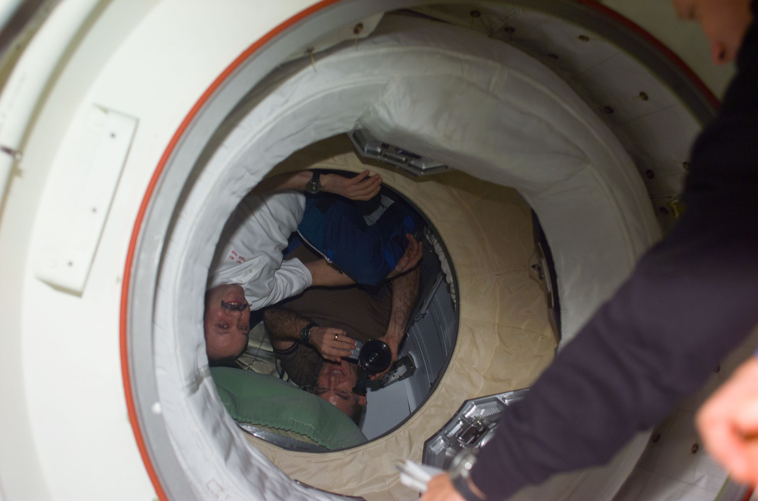 Expedition Two crew greet STS-104 crew at PMA-2 hatch