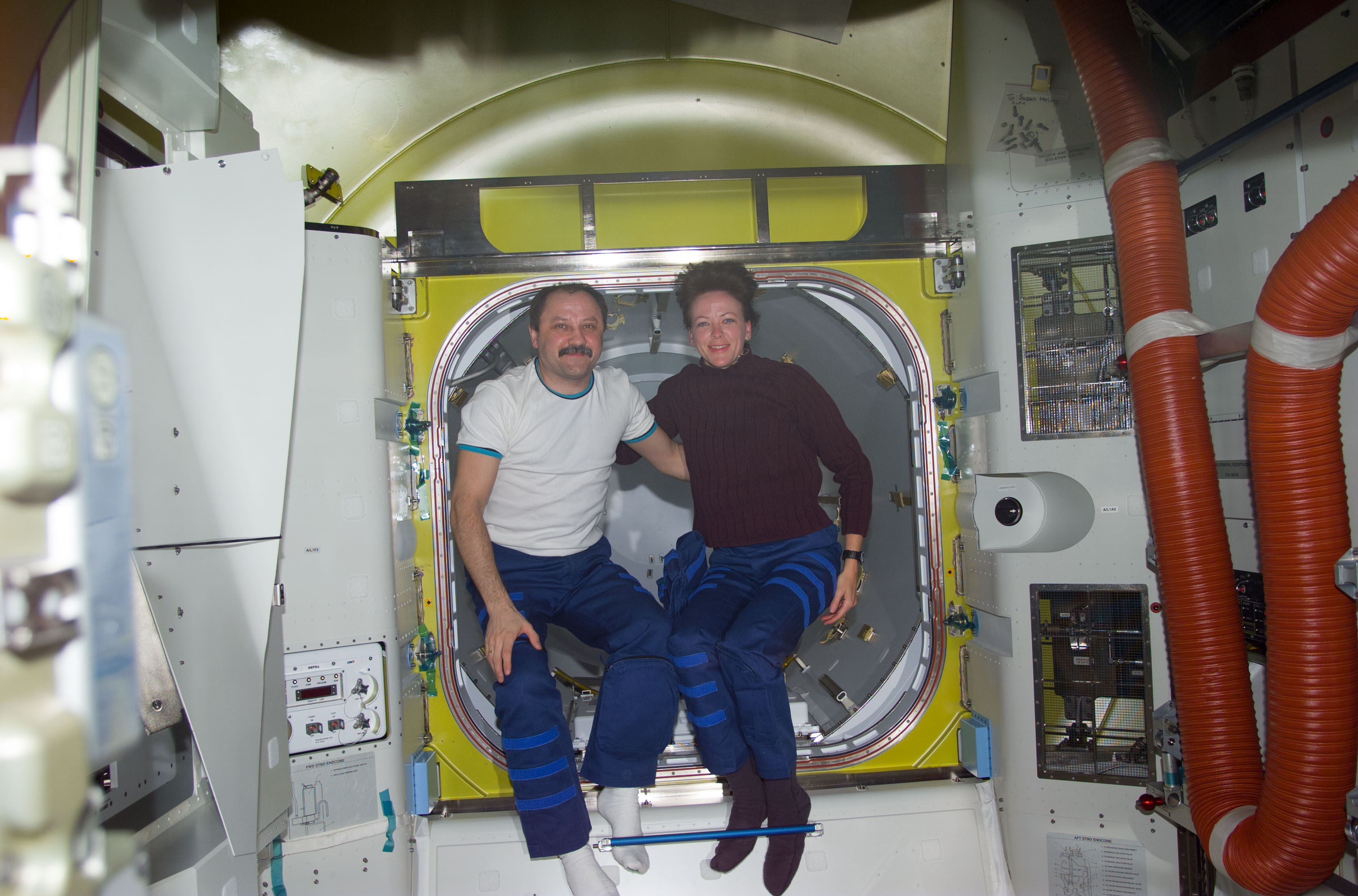 Usachev and Kavandi in front of crewlock endcone new Quest airlock