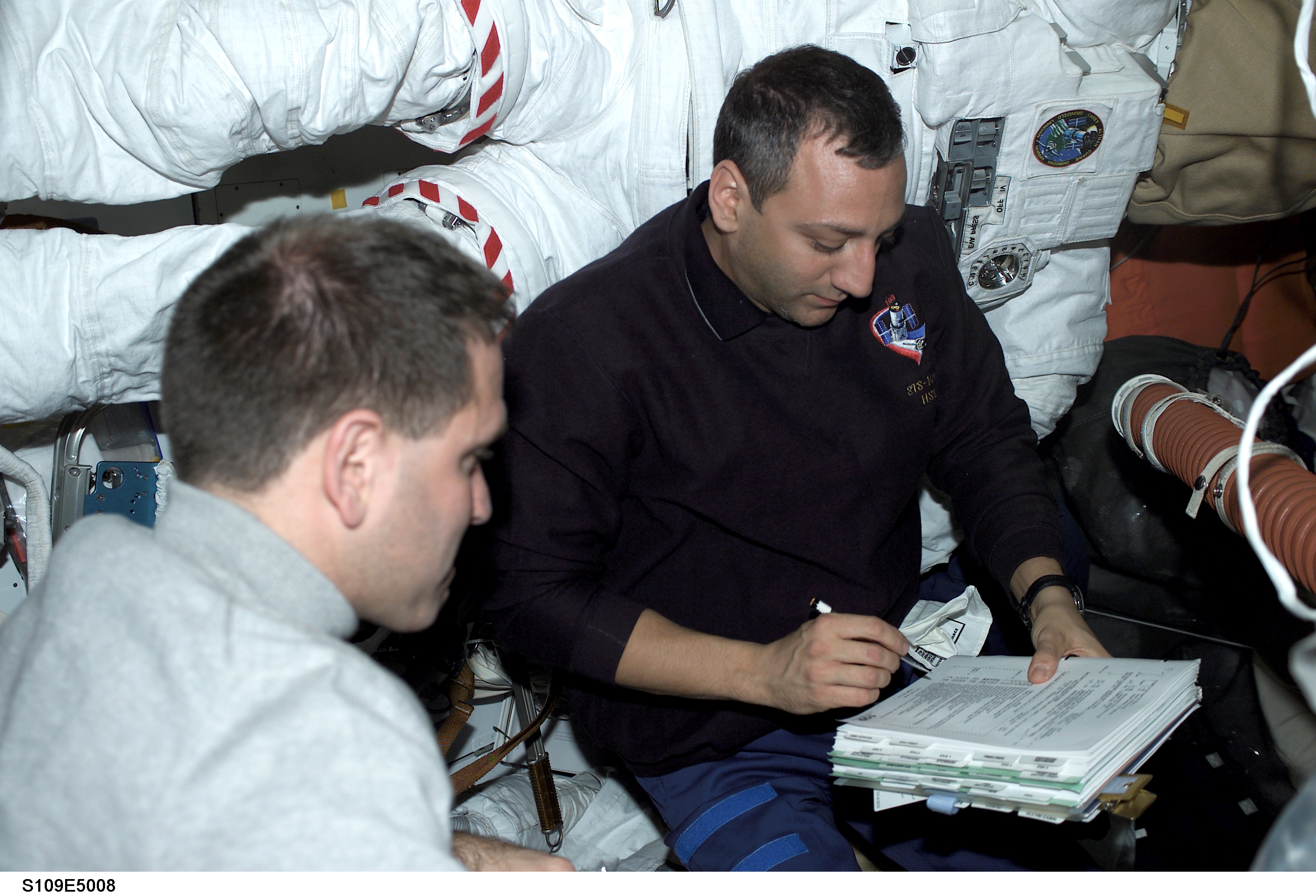 STS-109 MS Massimino and Grunsfeld on aft flight deck