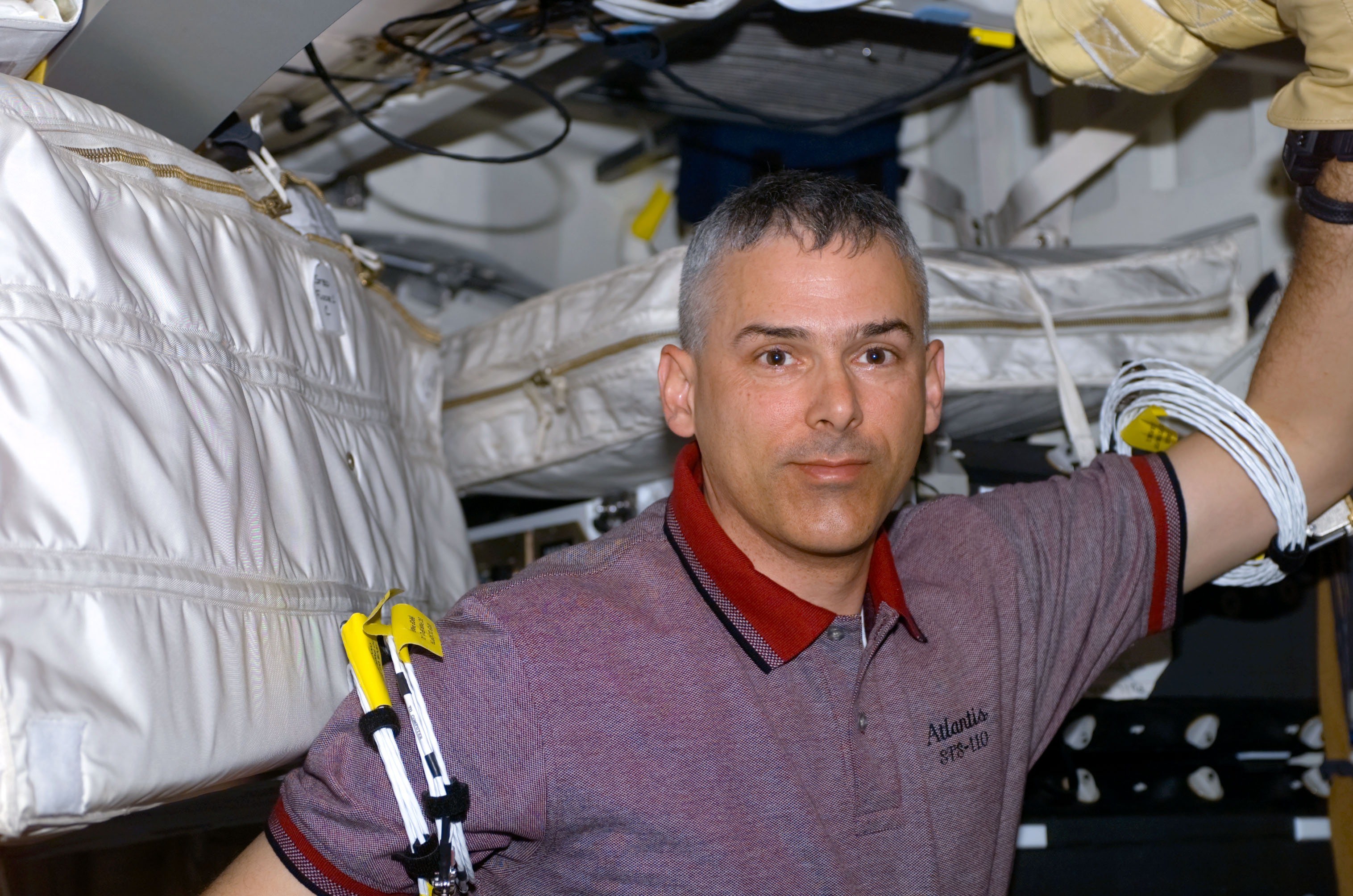 MS Morin poses on the middeck of Atlantis during STS-110