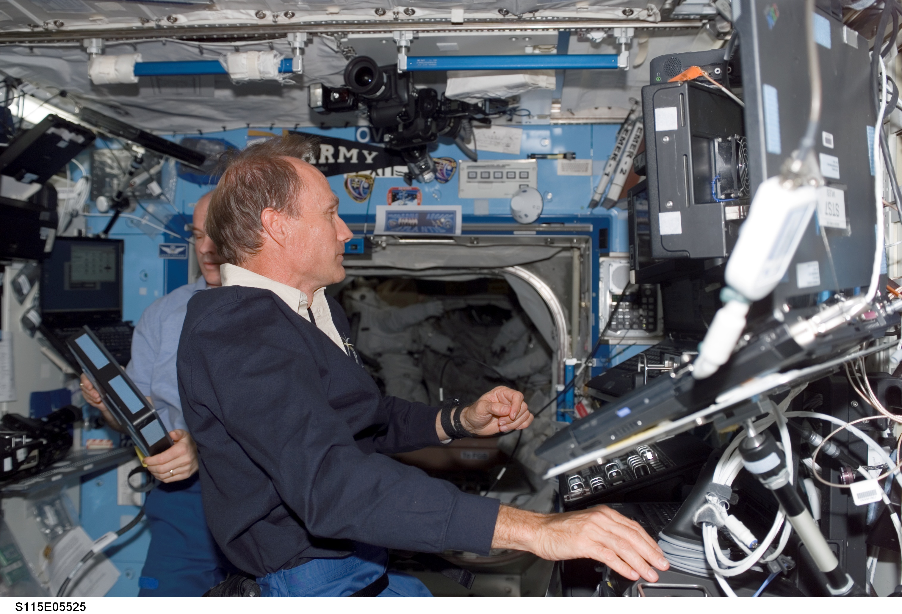 MacLean and Williams work at the Robotic Arm in the U.S. Laboratory during STS-115 EVA