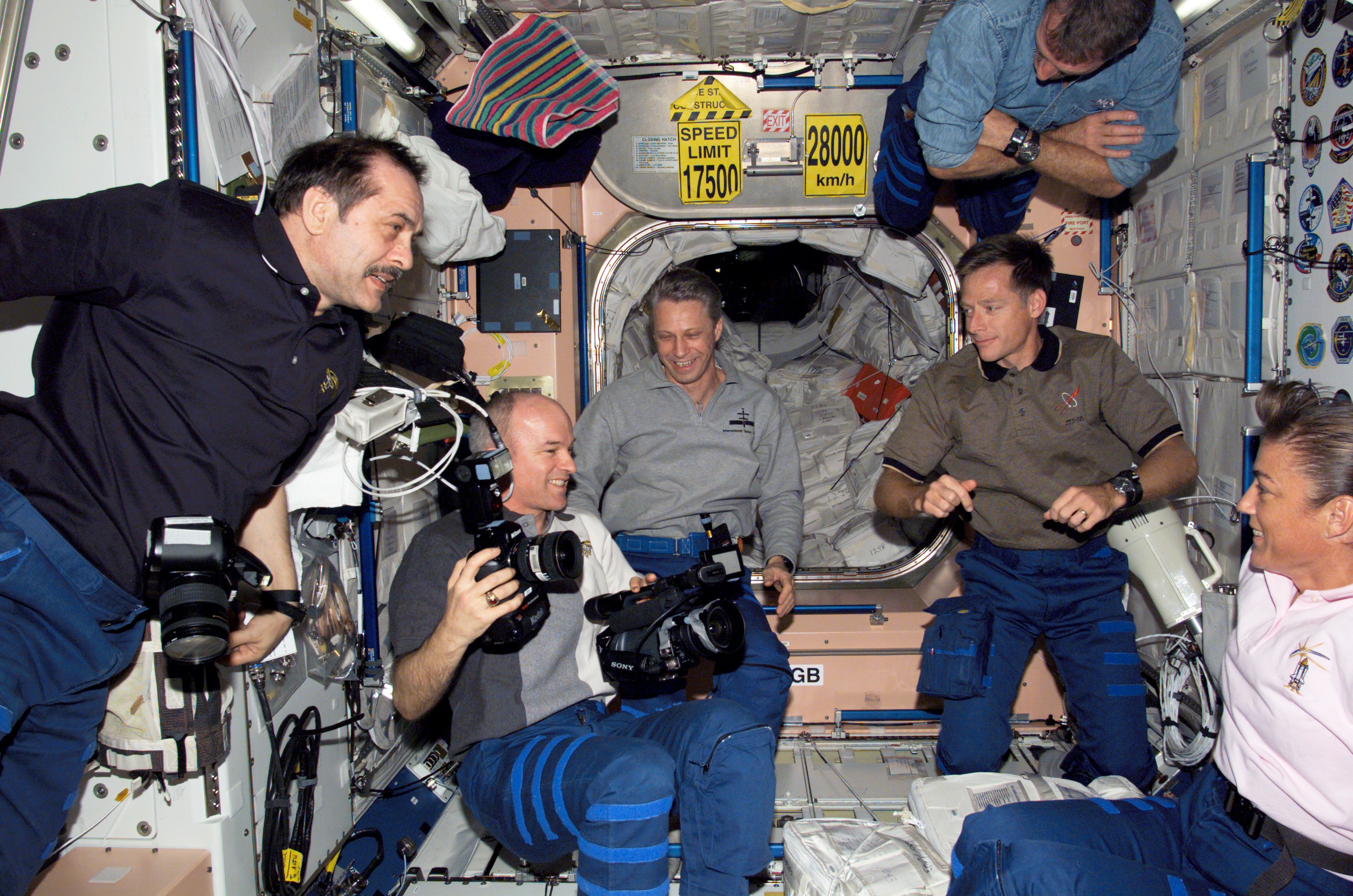 STS-115 and Expedition 13 crewmembers in the Node 1 during Joint Operations