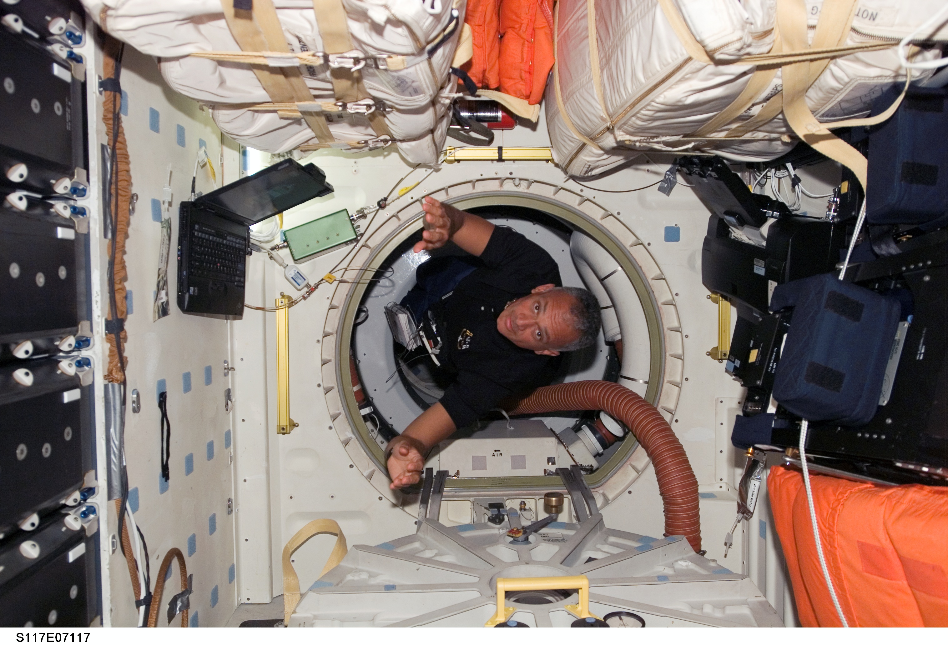 Olivas floats through hatch to the MDDK of STS-117 Space Shuttle Atlantis during Joint Operations