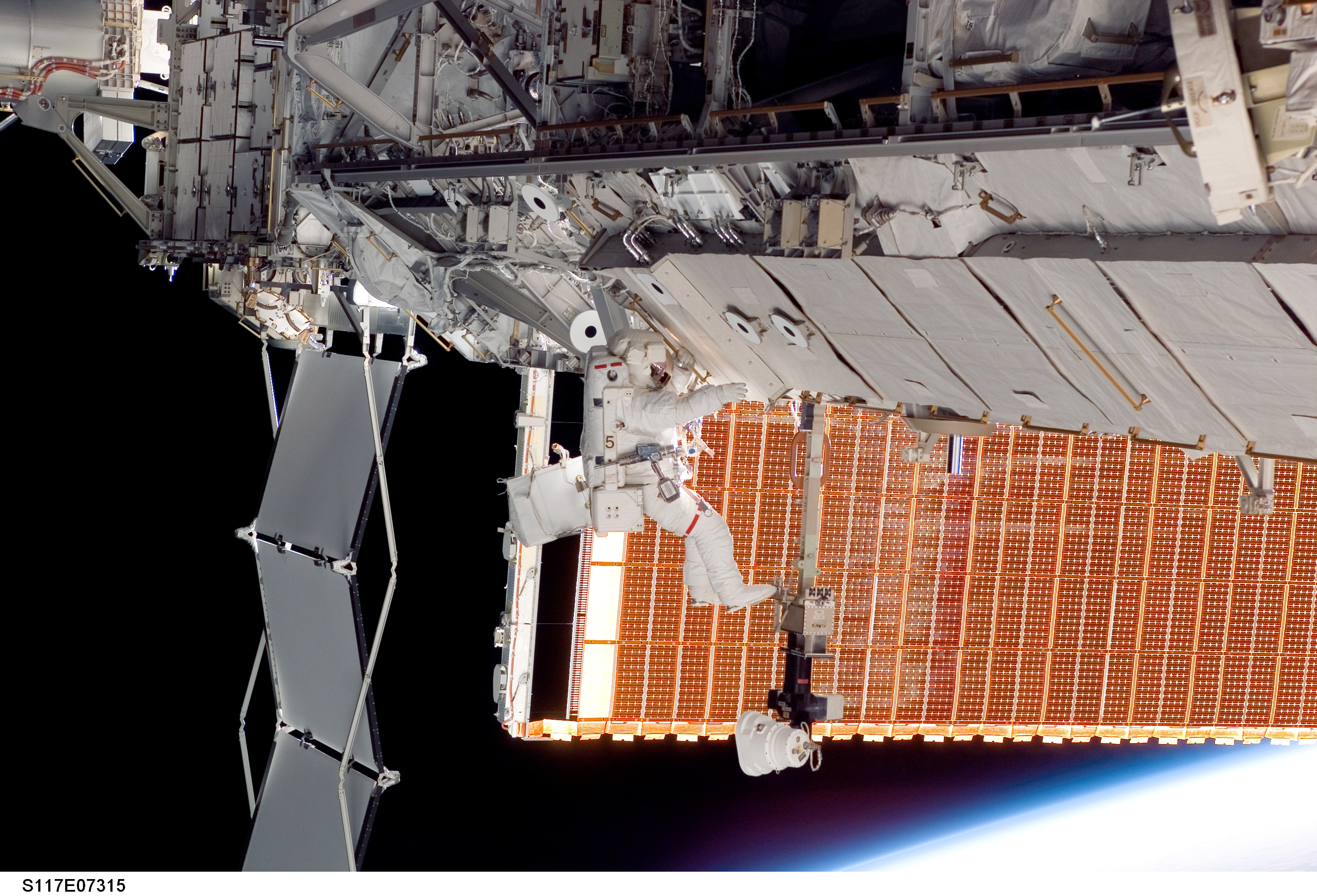 Forrester works at the P6 Truss during EVA 2 on STS-117 Mission