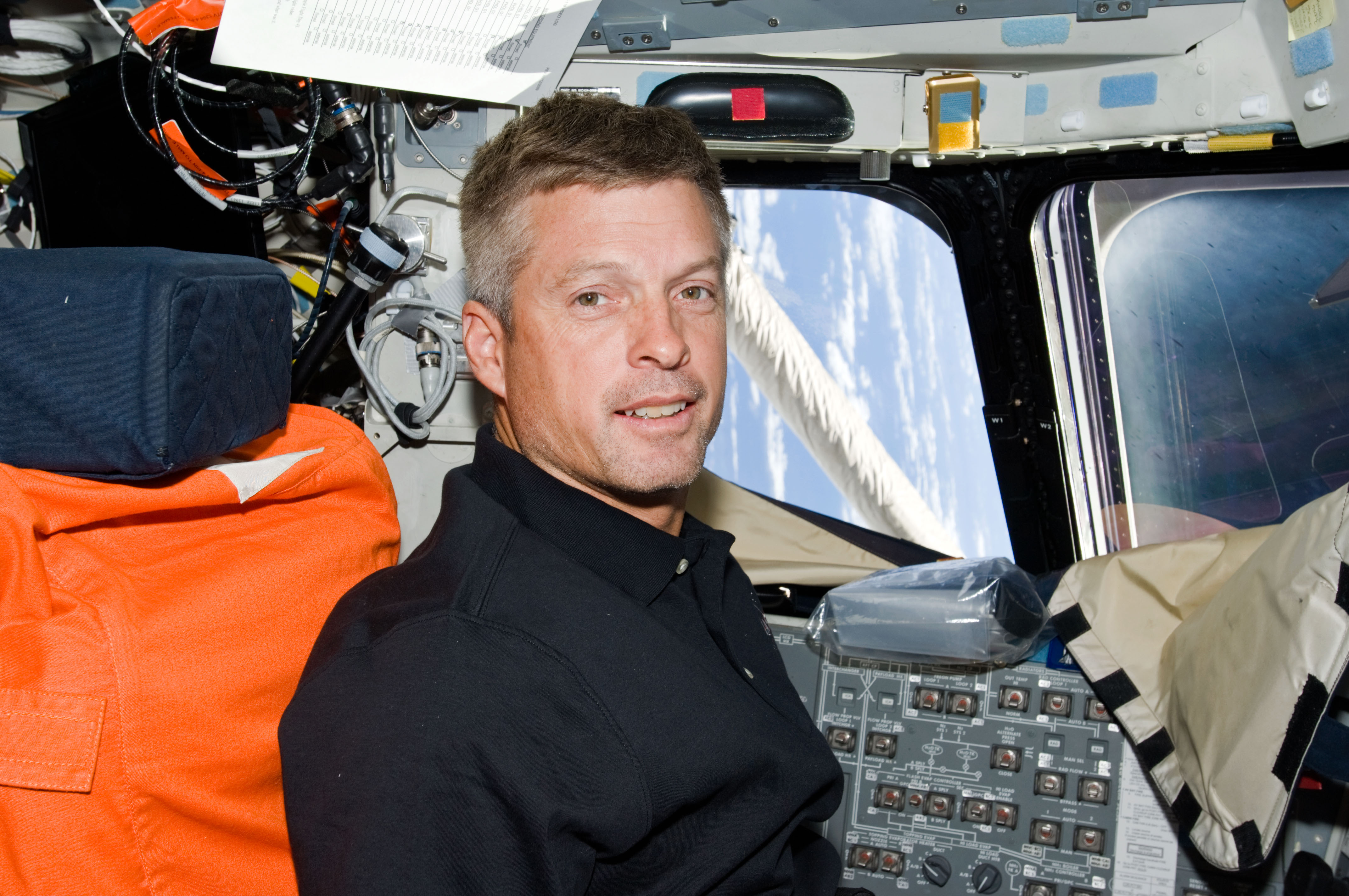 Swanson seated on Flight Deck (FD)
