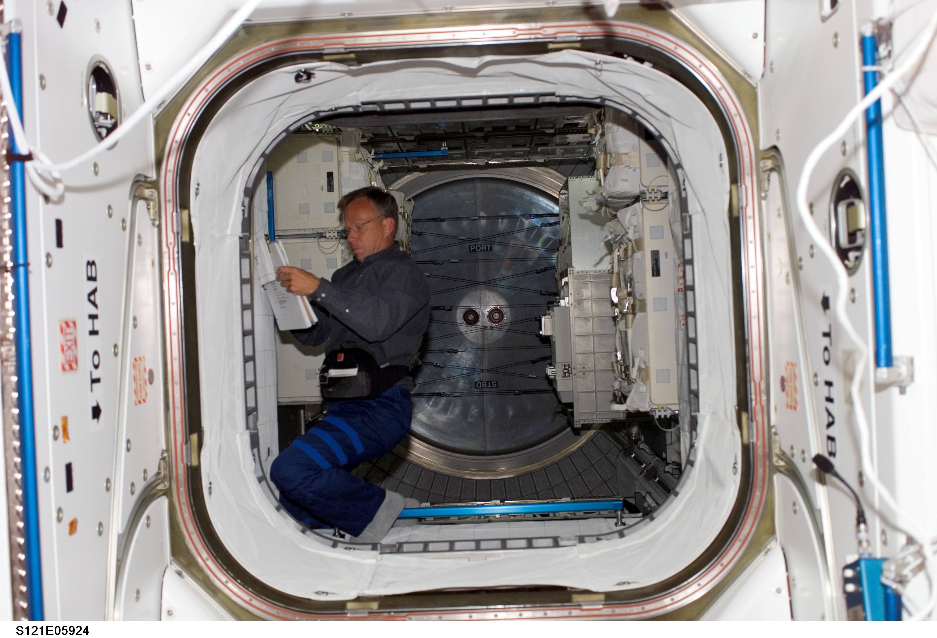 Lindsey inside the MPLM module during STS-121/ Exp. 13 joint OPS
