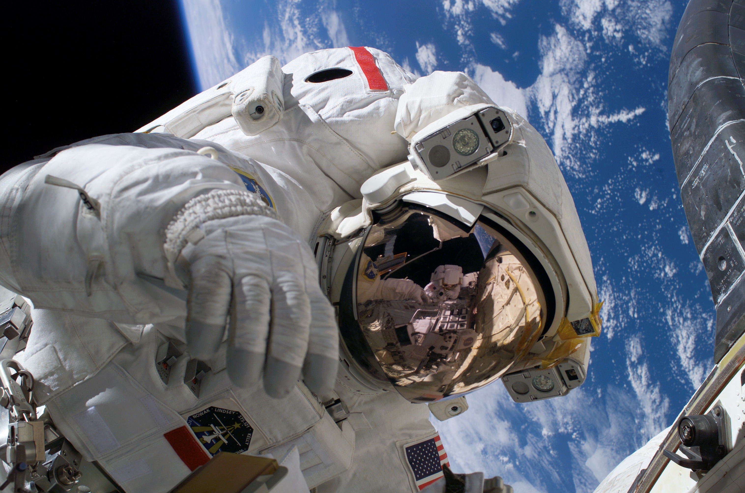 Mid-shot of Seller on EVA3 during STS-121 / Expedition 13 joint operations