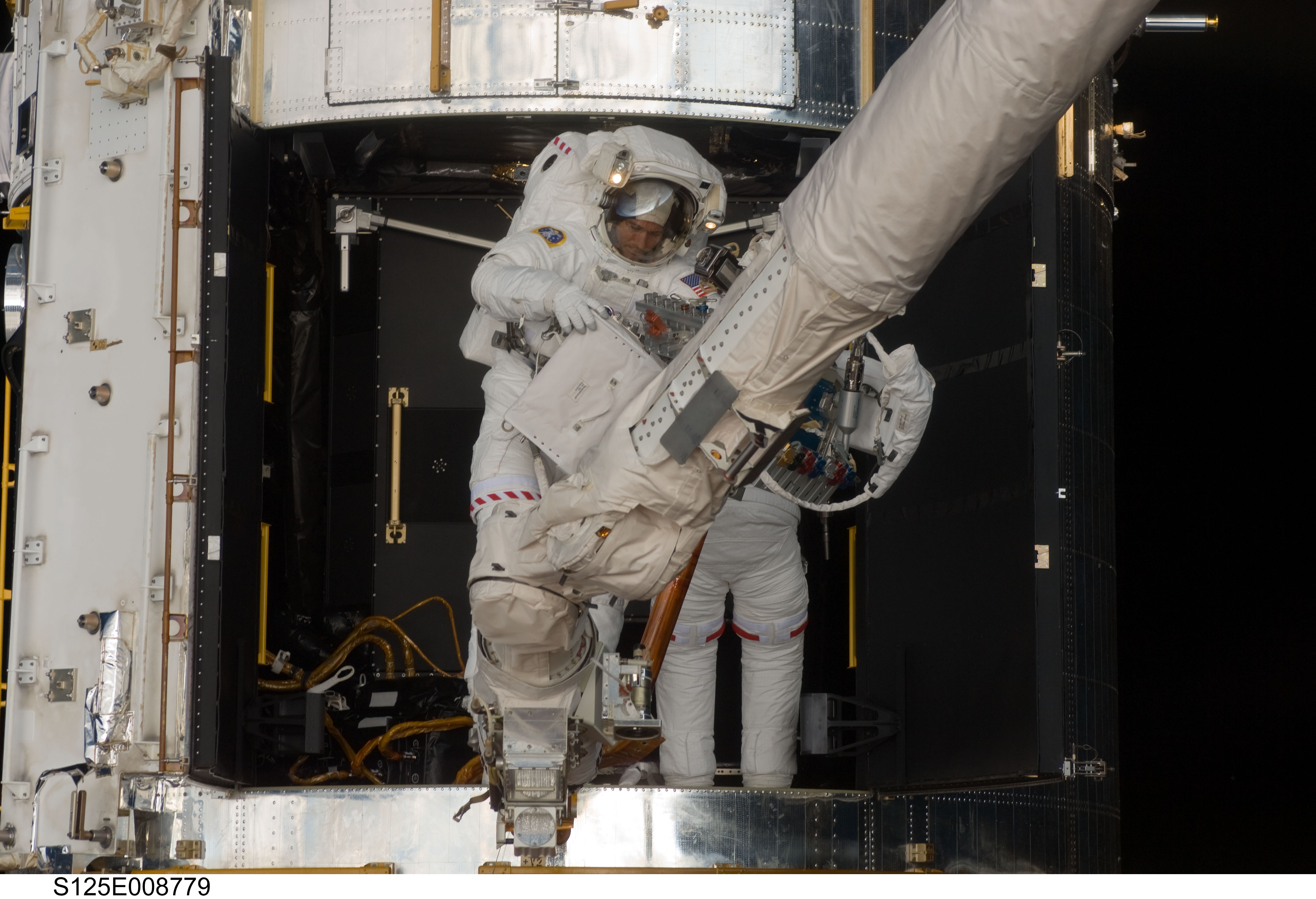 STS-125 MS1 Good and MS4 Massimino during EVA4