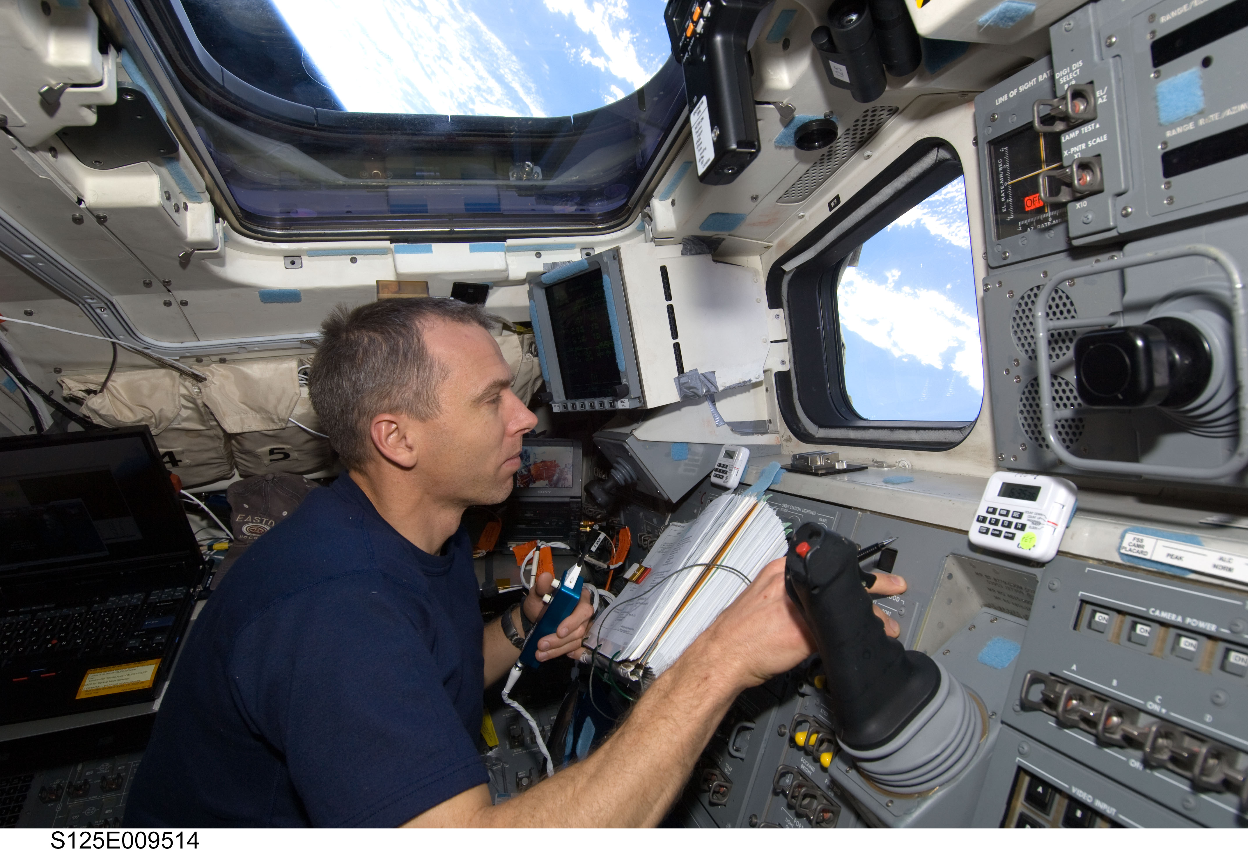 STS-125 MS5 Andrew Feustel works on the Flight Deck during Flight Day 7