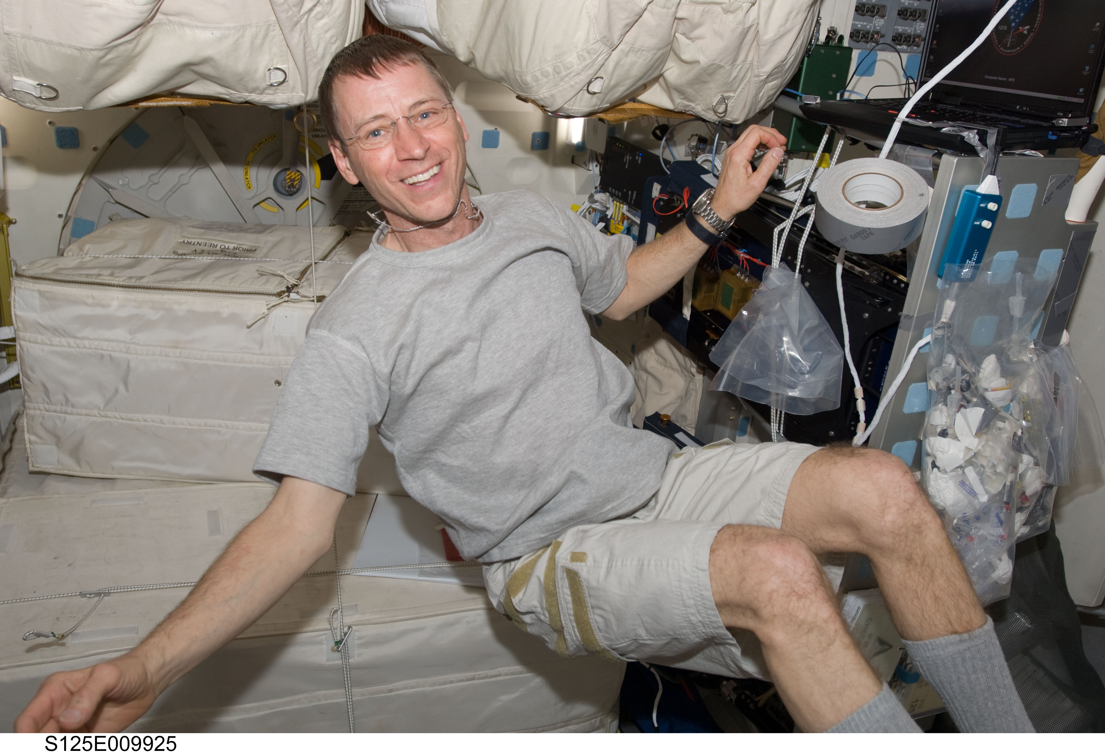 STS-125 Pilot Gregory Johnson poses for a photo on the Middeck
