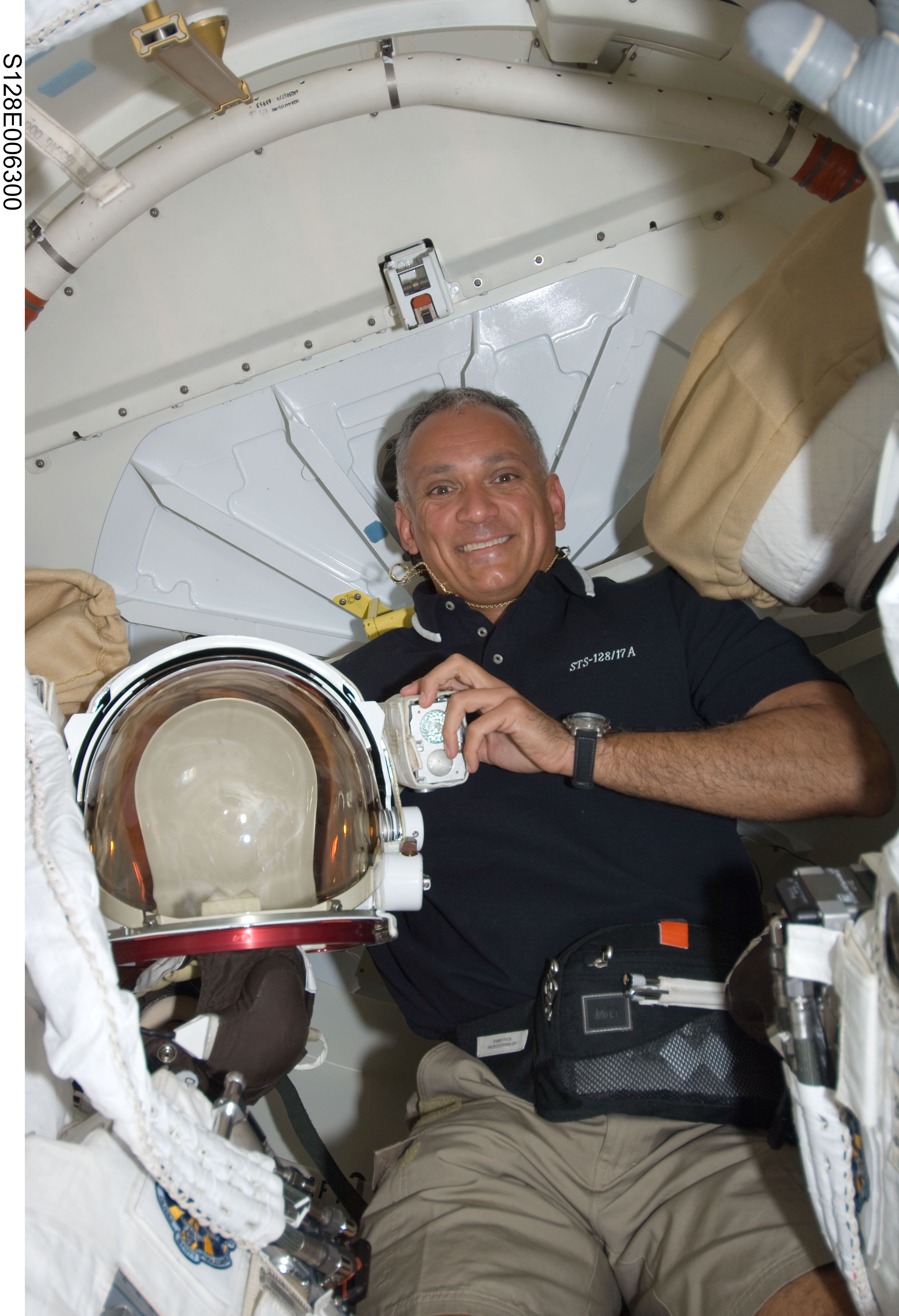 Olivas in Shuttle Airlock with Extravehicular Mobility Units (EMU)s during STS-128