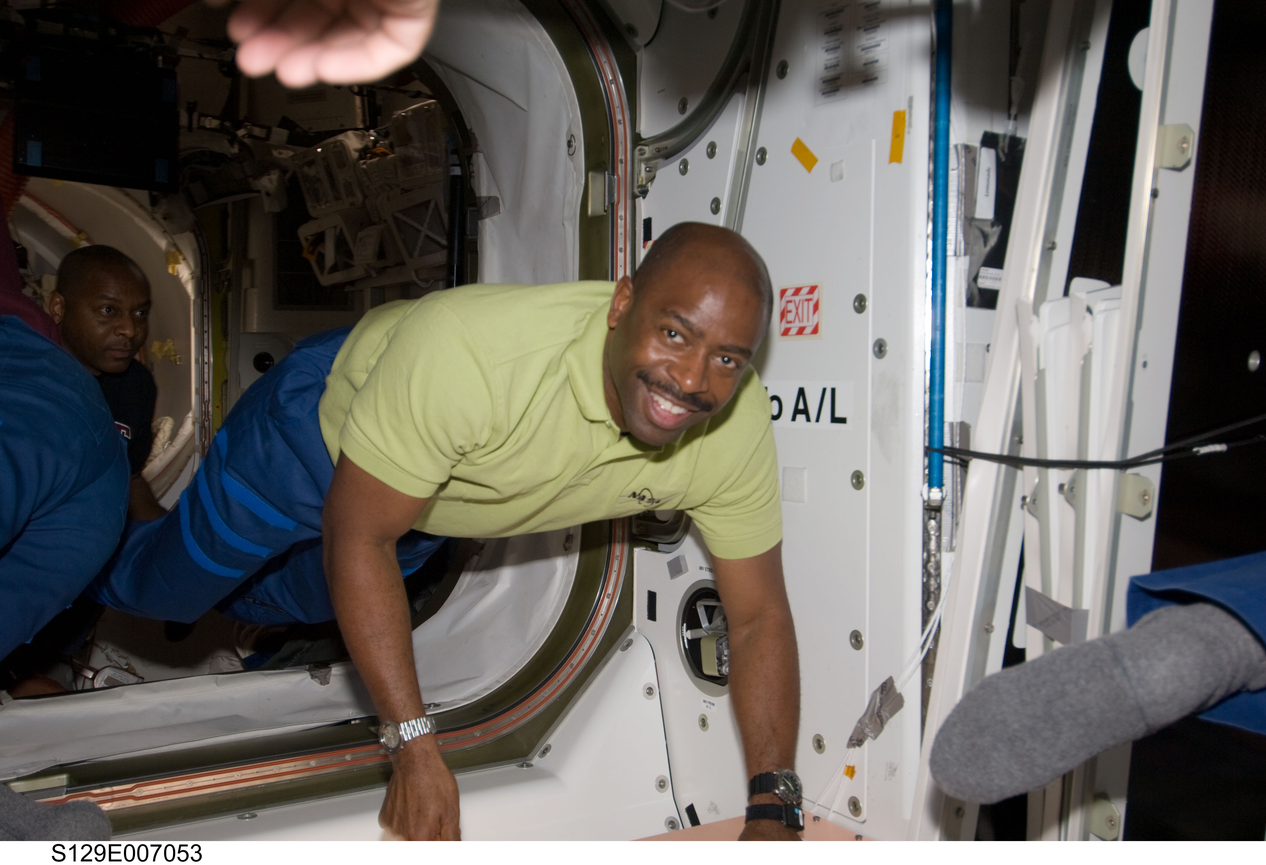 Crew Member posing for photo during STS-129/Expedition 21 Joint Operations