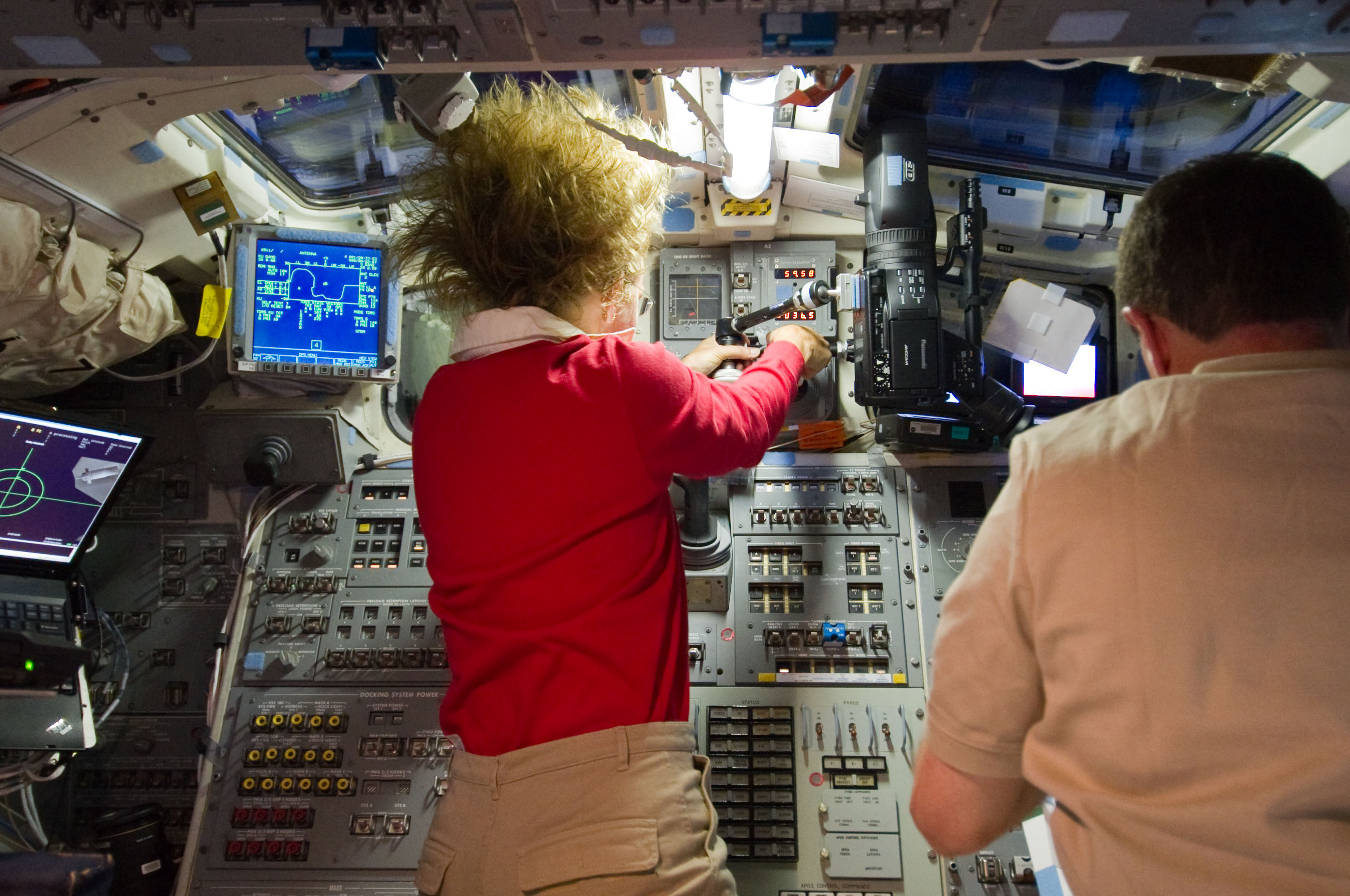 Magnus and Walheim on Atlantis Aft Flight Deck during Rendezvous OPS