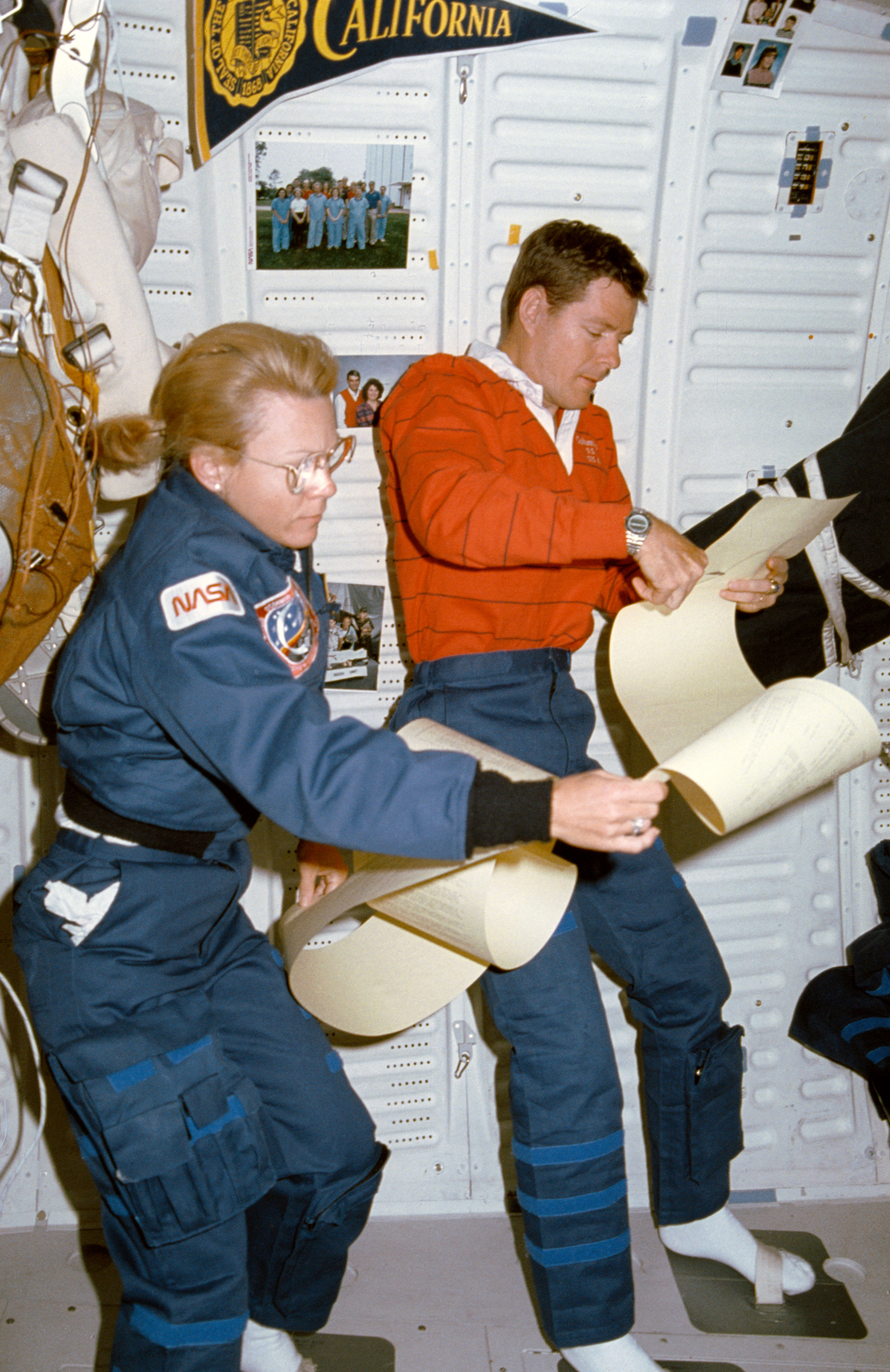 STS-40 MS Seddon & Commander O'Connor review TAGS printout on OV-102 middeck
