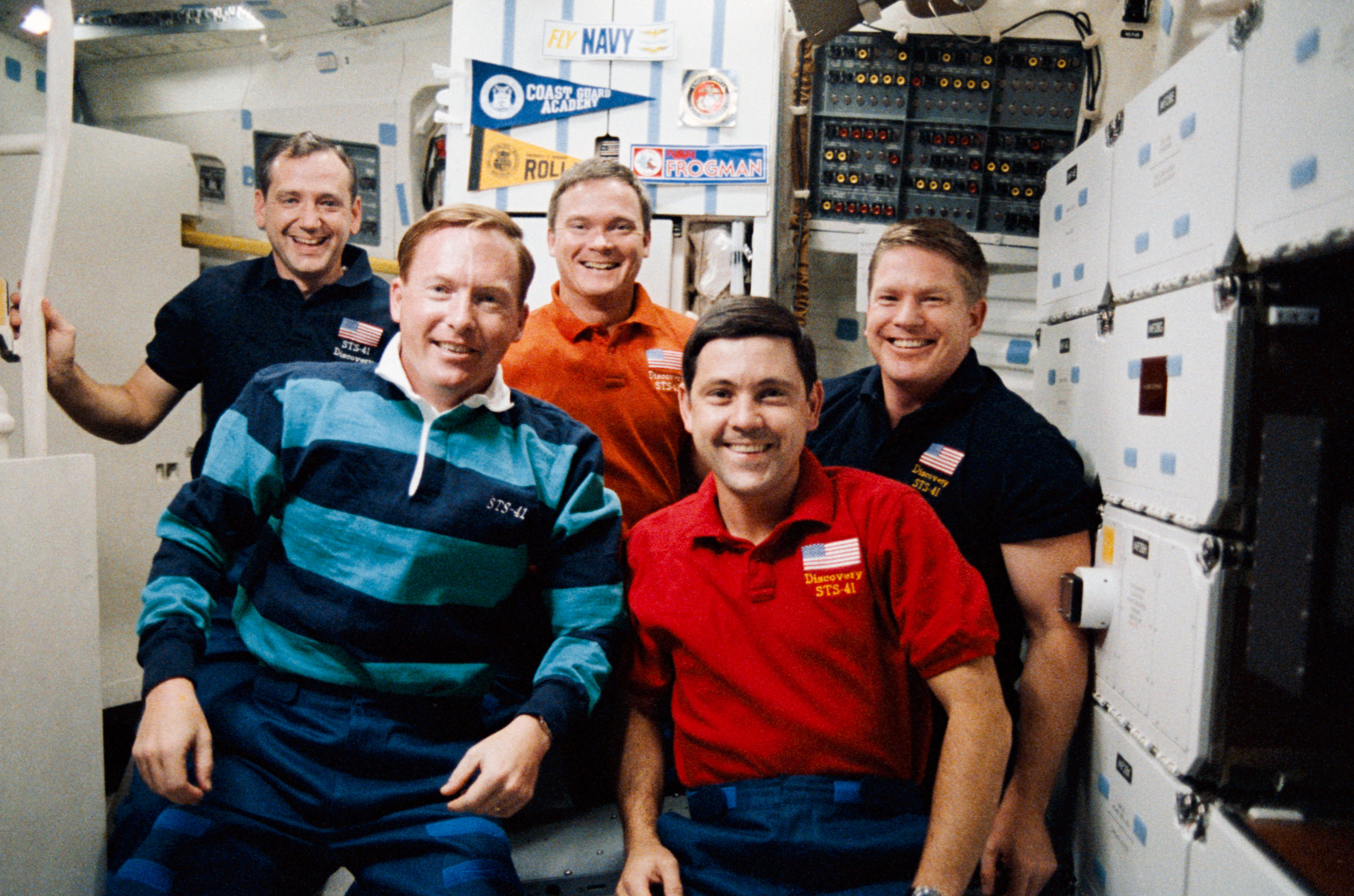 STS-41 crewmembers pose on OV-103's middeck for inflight (in-space) portrait