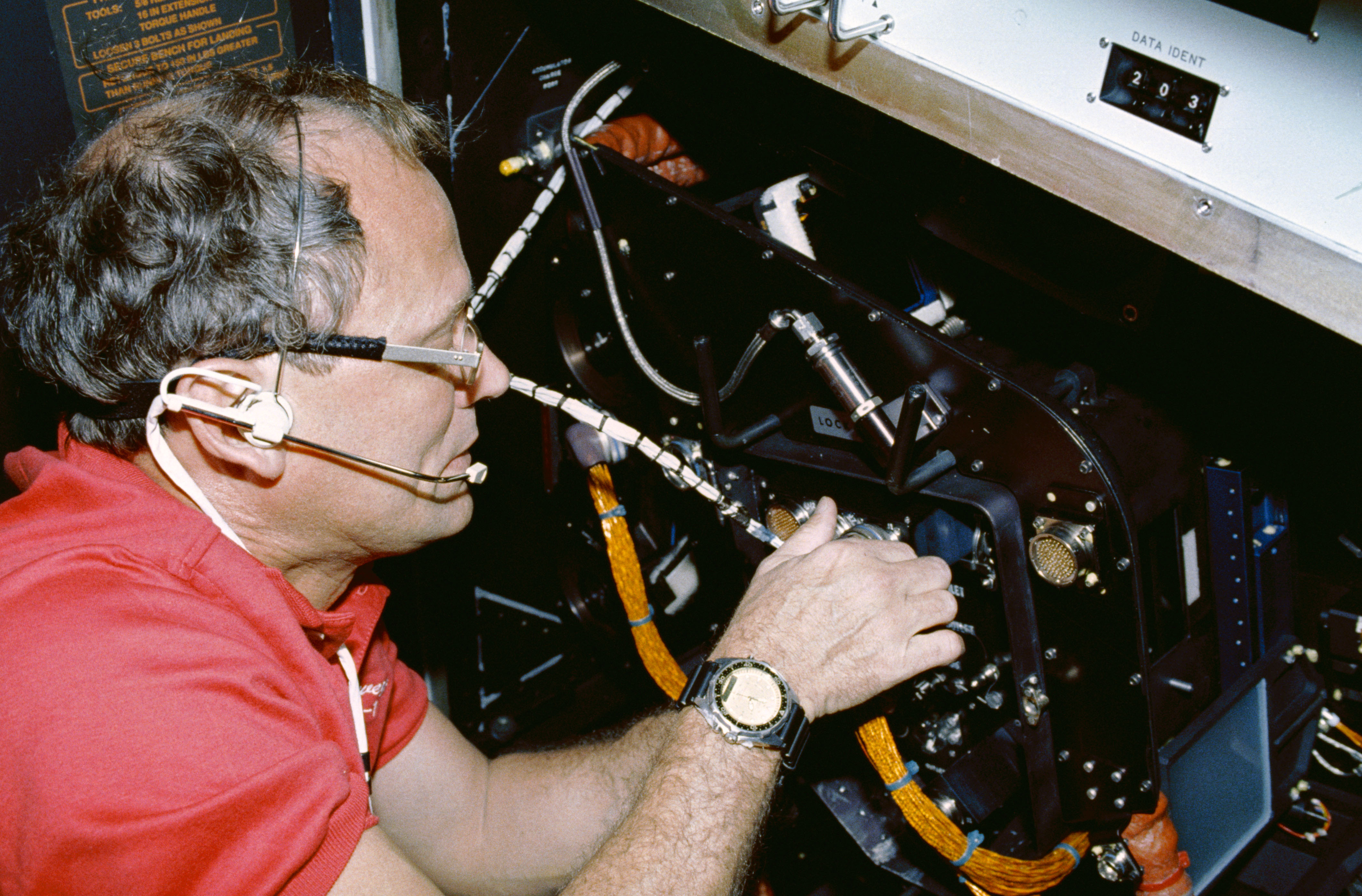 STS-42 MS/PLC Norman E. Thagard adjusts Rack 10 FES equipment in IML-1 module