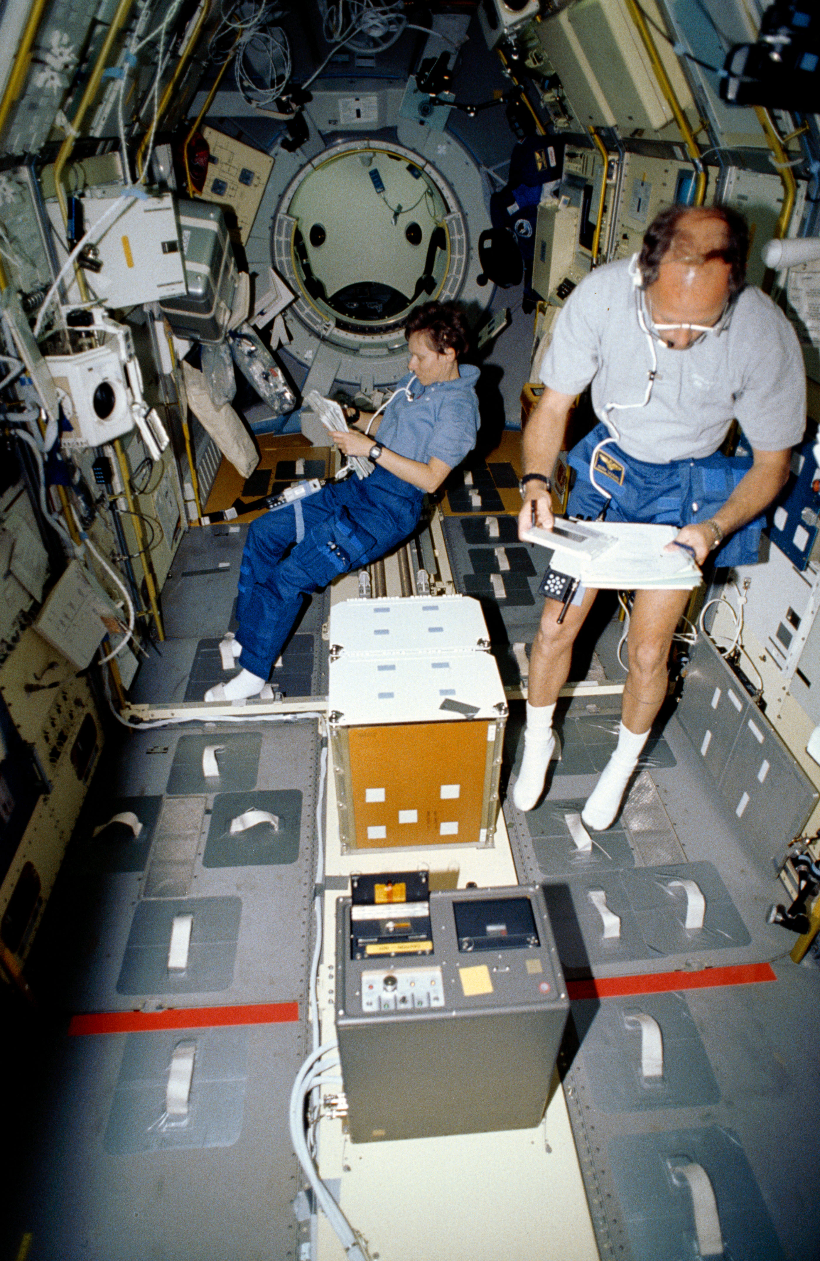 STS-42 MS/PLC Thagard and Payload Specialist Bondar work in IML-1 spacelab