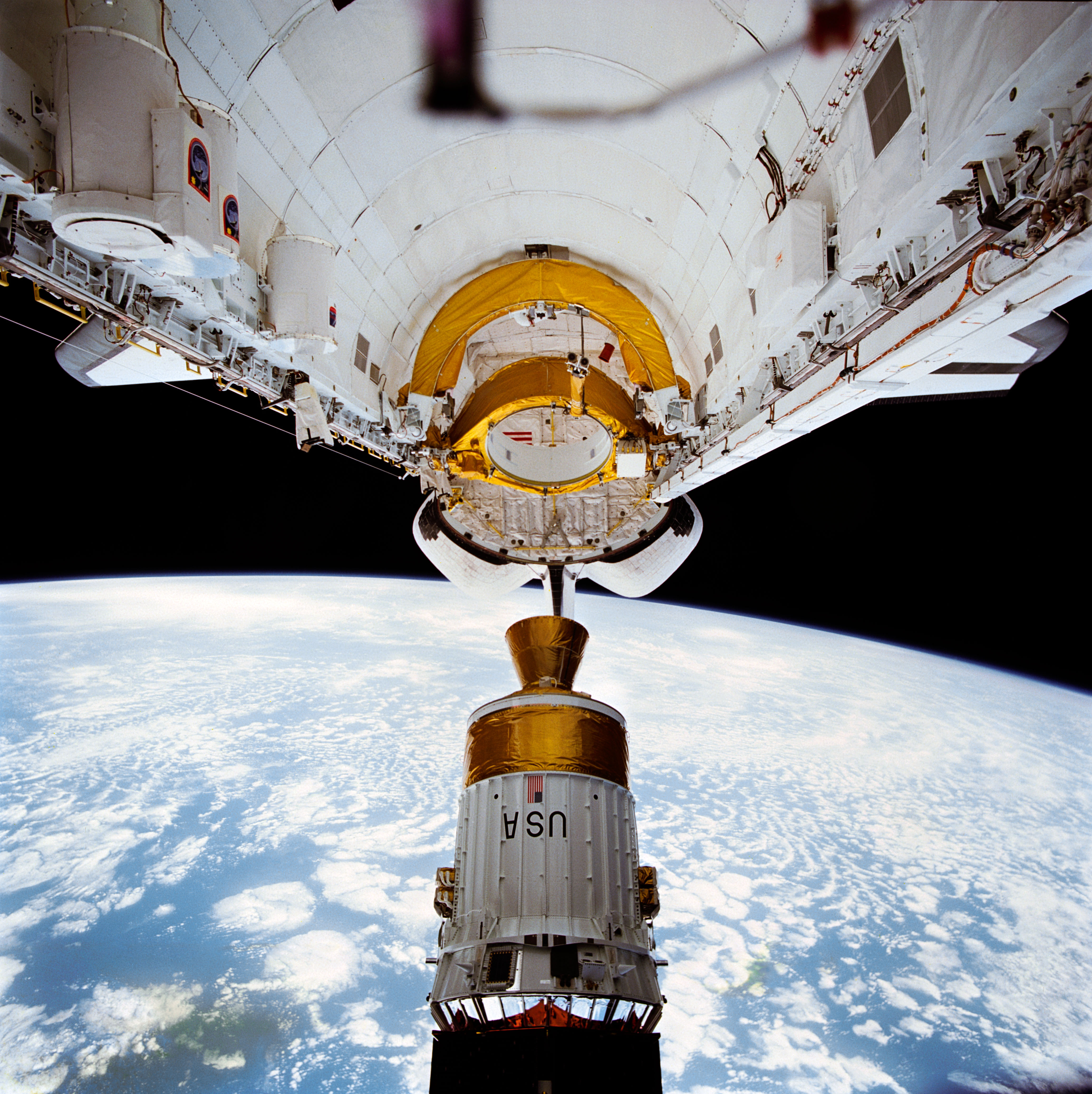 STS-43 TDRS-E / IUS is deployed from OV-104's payload bay (PLB)