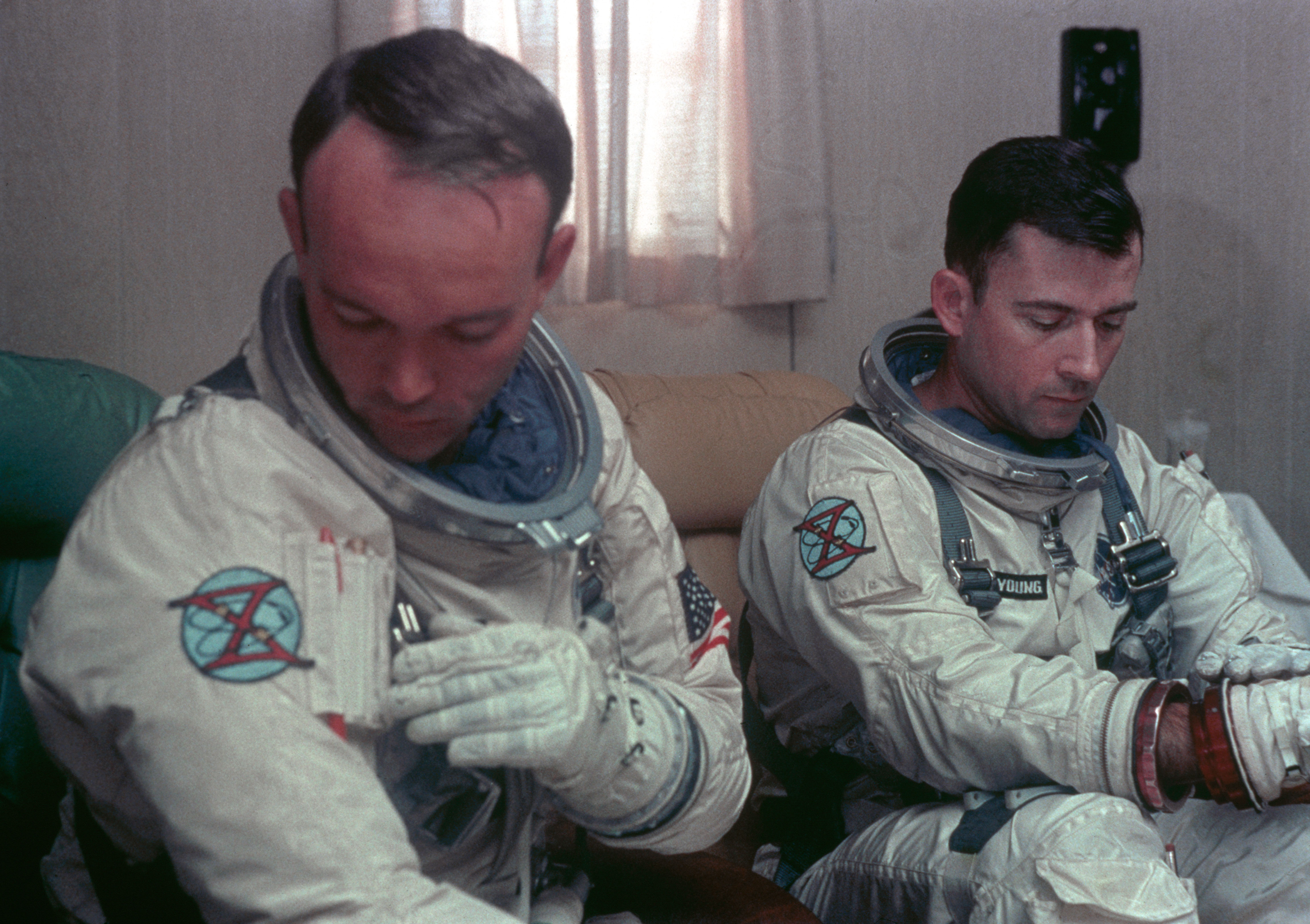 Astronauts Young and Collins undergo suiting up operations during countdown