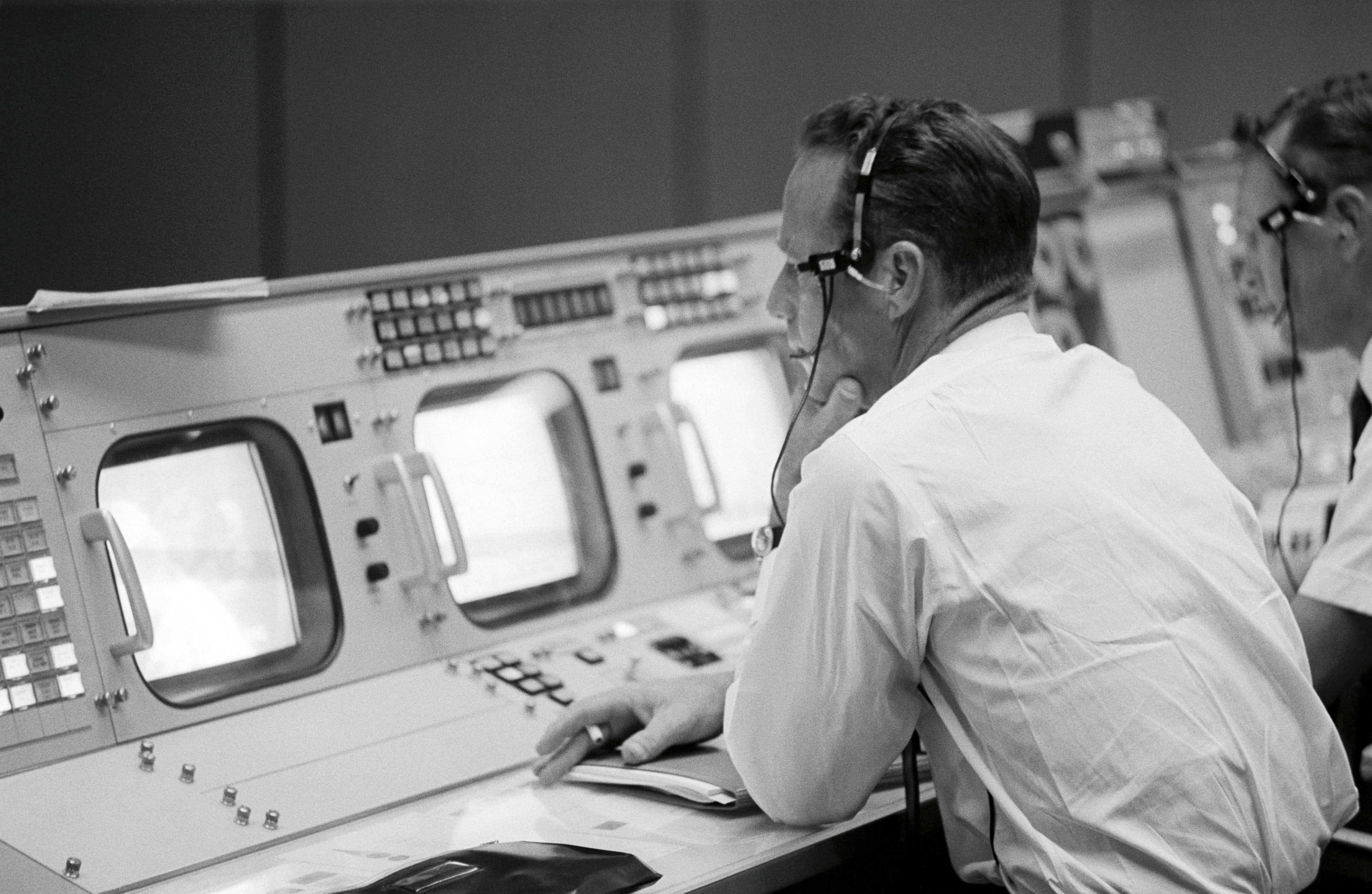Astronaut M. Scott Carpenter monitors Booster System Console in MCC