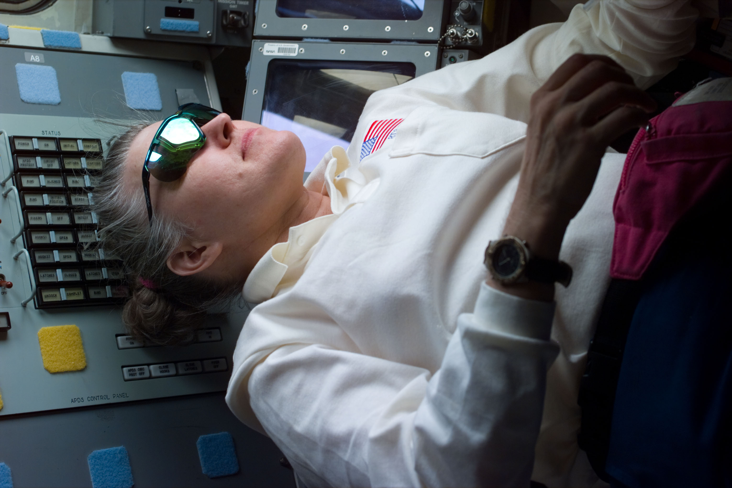 Astronaut Lucid on flight deck with sunglasses