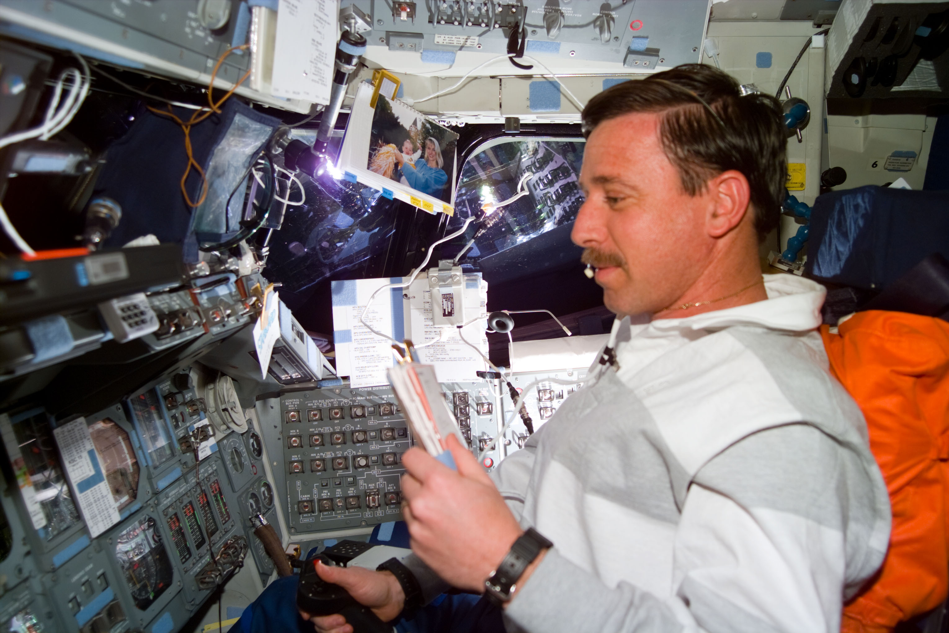 Pilot Scott Horowitz consults a checklist during a Vernier burn