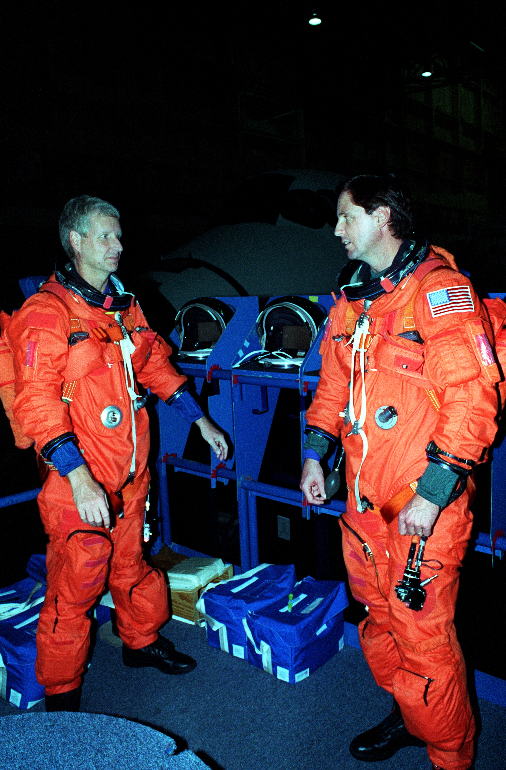 STS-82 Suit-up for Post Insertion Training in Crew Compartment Trainer 2