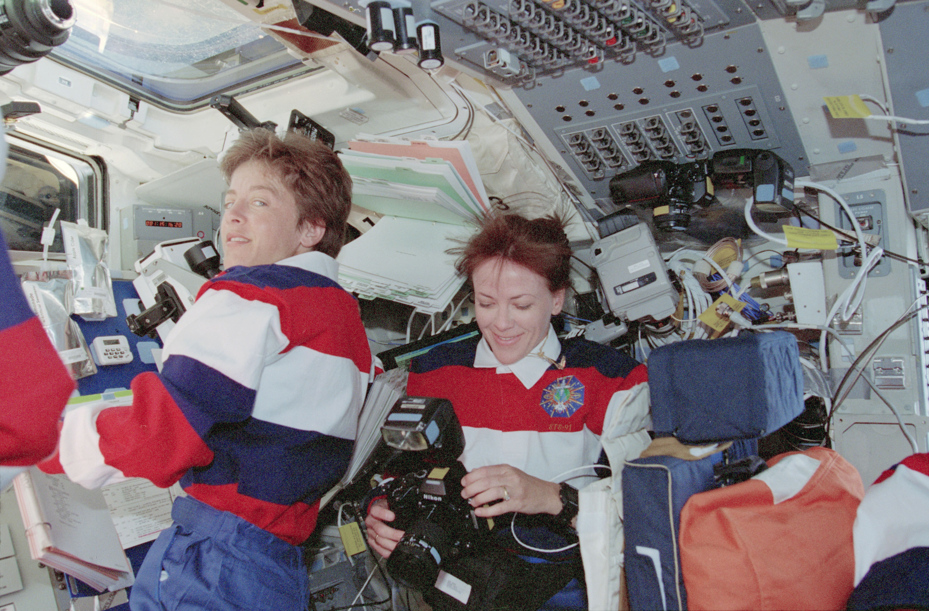 Crewmember activity in flight deck during rendezvous operations