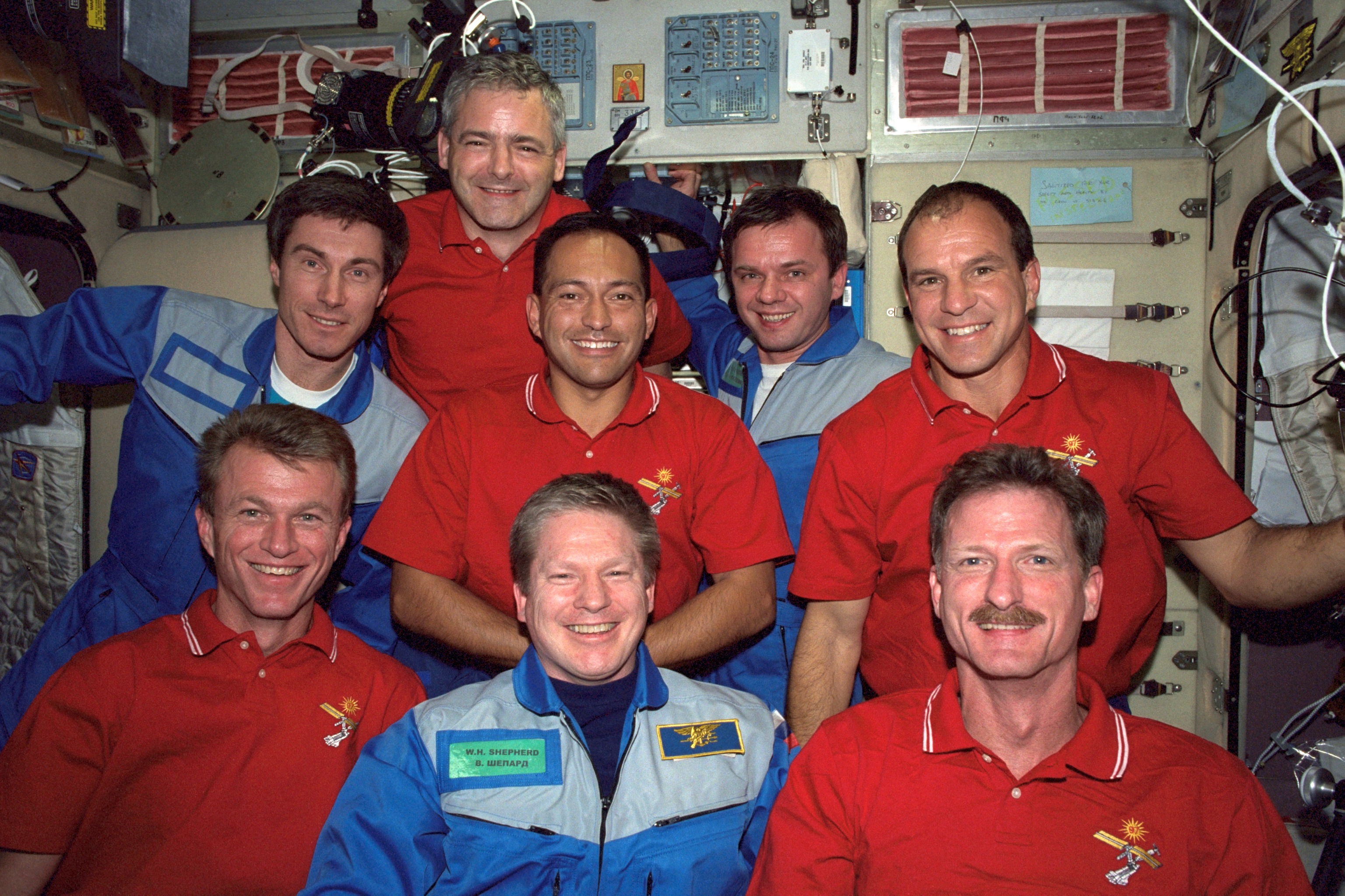 STS-97 and Expedition One crewmembers pose for a photo in the Service Module