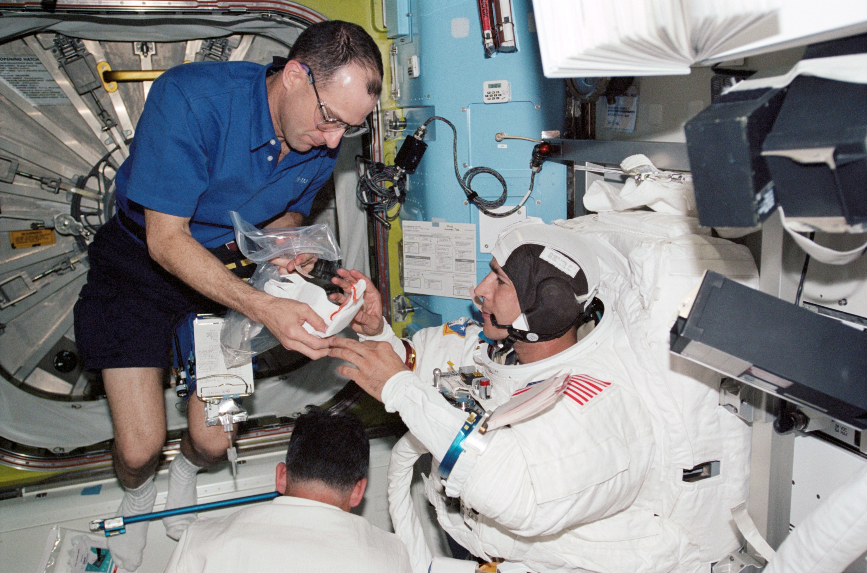 Herrington and Pettit during STS-113 EVA 2 EMU don in Quest A/L