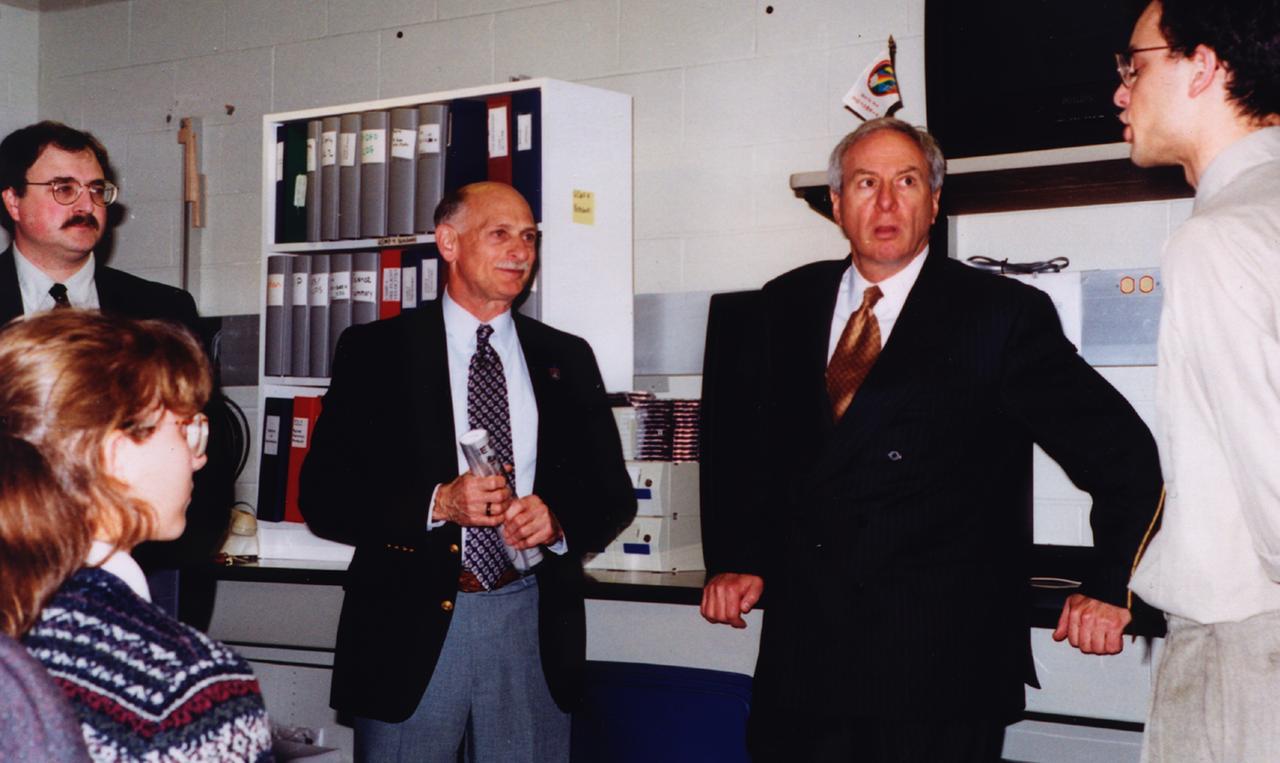 NASA Administrator Daniel Goldin (second from right) visits the control room of the Isothermal Dendritic Growth Experiment (IDGE) in Remote Operations Control Center (ROCC) at Rensselaer Polytechnic Institute (RPI)in Troy, NY, during RPI's 175th arniversary. IDGE, flown on three Space Shuttle missions, is yielding new insights into virtually all industrially relevant metal and alloy forming operations. Photo credit: RPI