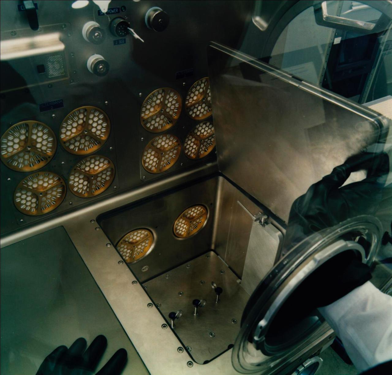 This photo shows the access through the internal airlock (bottom right) on the Microgravity Science Glovebox (MSG) being developed by the European Space Agency (ESA) and NASA for use aboard the International Space Station (ISS). Scientists will use the MSG to carry out multidisciplinary studies in combustion science, fluid physics and materials science. The MSG is managed by NASA's Marshall Space Flight Center (MSFC). Photo Credit: NASA/MSFC